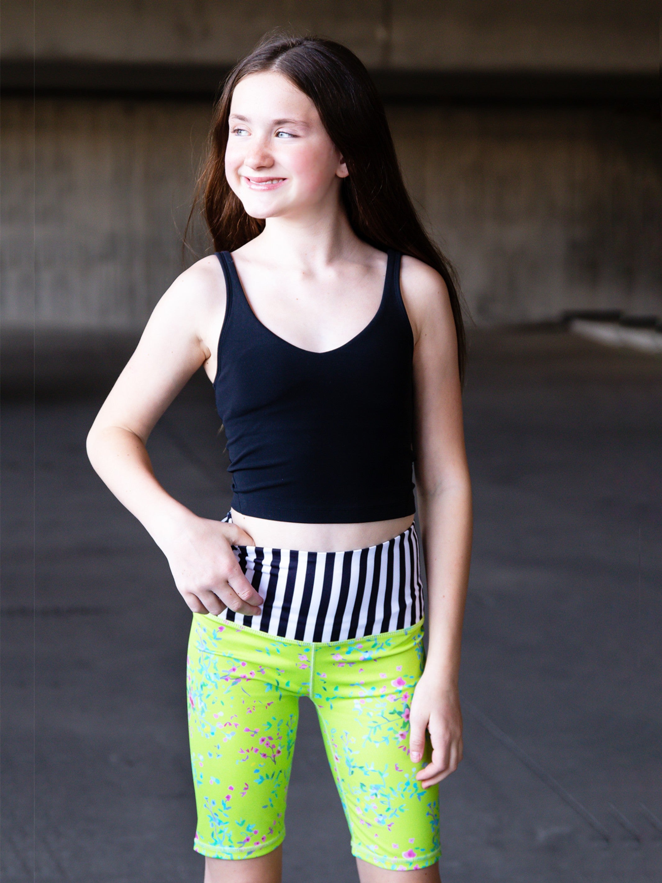 Limeapple CAROLE High-Waisted Active Bike Shorts in green floral print, designed for active girls with a comfortable fit and stylish look.