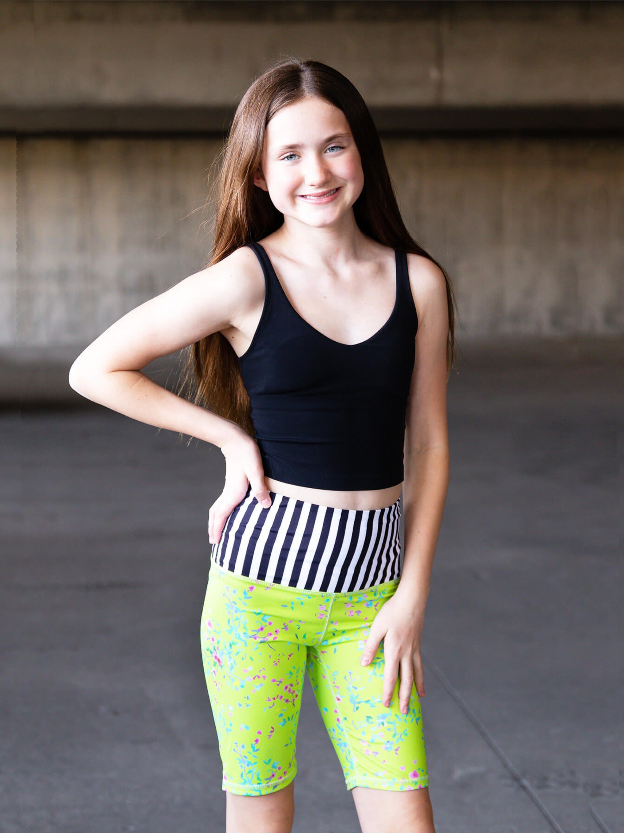 Limeapple CAROLE High-Waisted Active Bike Shorts in green floral print, designed for active girls with a comfortable fit and stylish look.