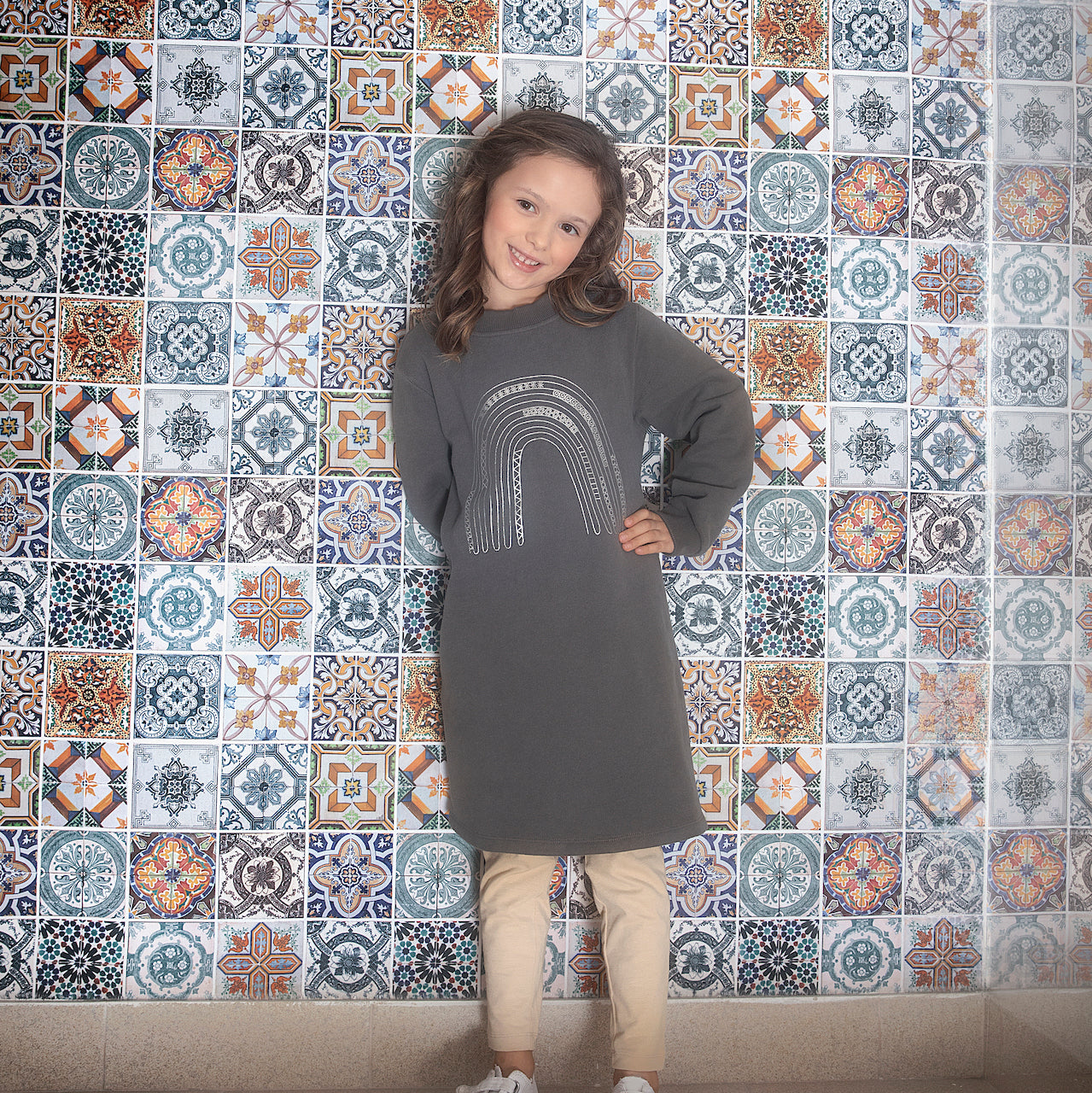 A stylish winter dress for girls in midnight grey, featuring long sleeves, a ribbed round collar, and side pockets, made from soft brushed cotton fleece.