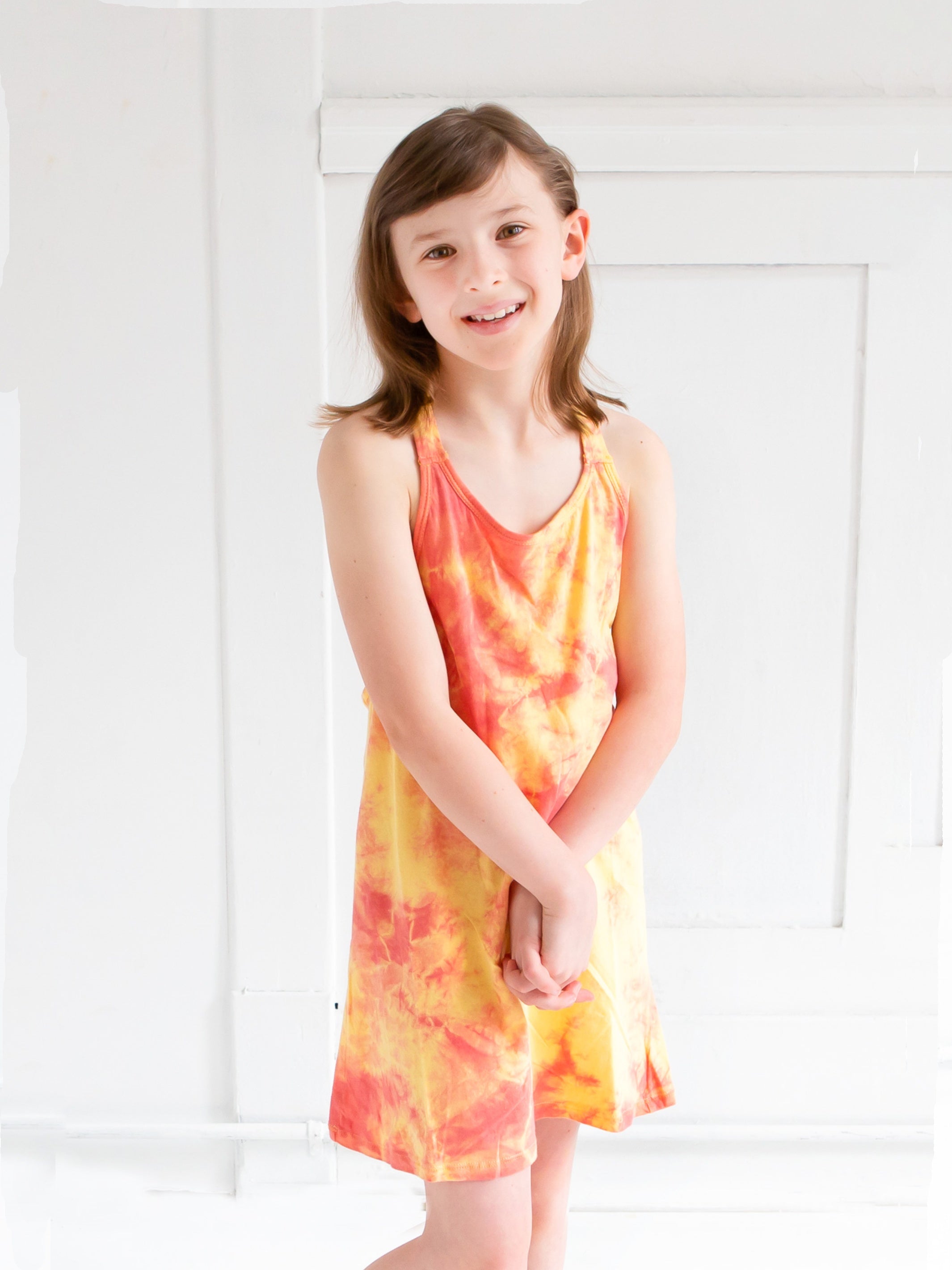 Em Braided Tie Dye Tank Dress in vibrant colors with braided back detail, perfect for summer wear.