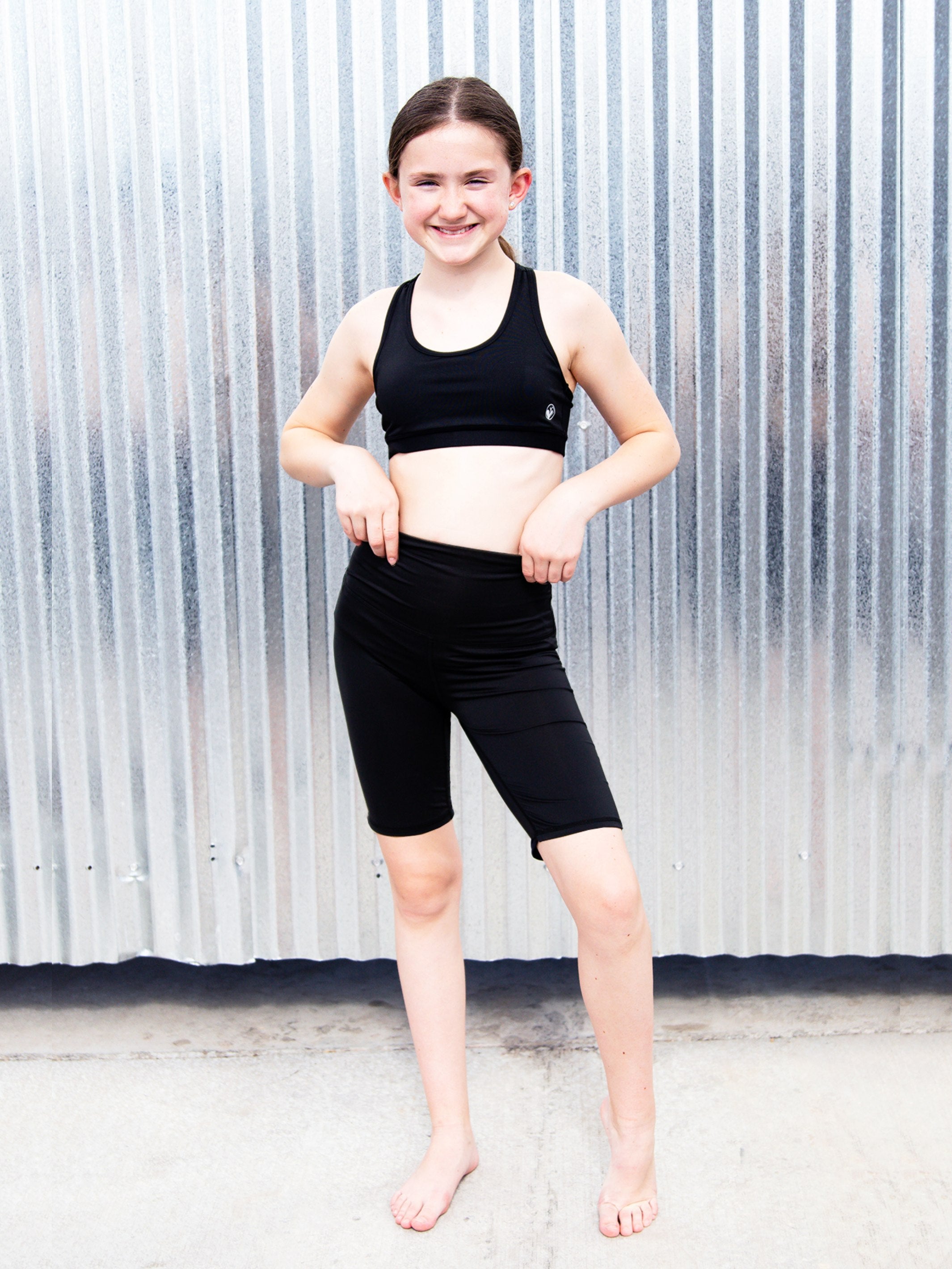 Tessa High-Waisted Active Bike Shorts by Limeapple in black, featuring a smooth waistband and hidden zip pocket.
