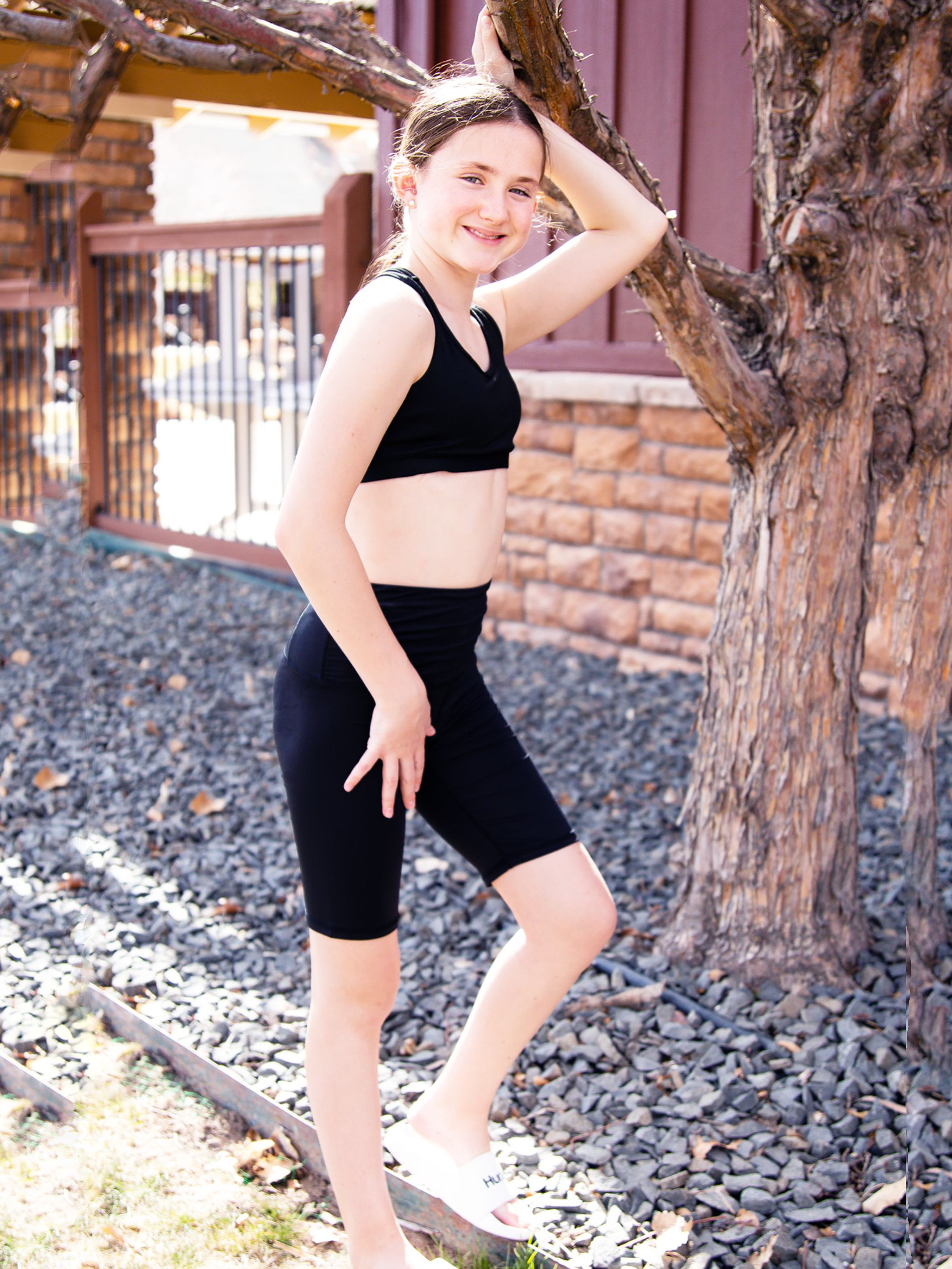 Tessa High-Waisted Active Bike Shorts by Limeapple in black, featuring a smooth waistband and hidden zip pocket.