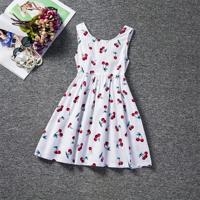 White sundress with cherry print.
