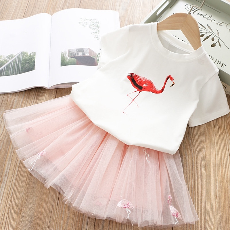 Pink tulle skirt and flamingo shirt.