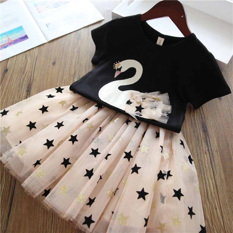 Black swan dress with stars.