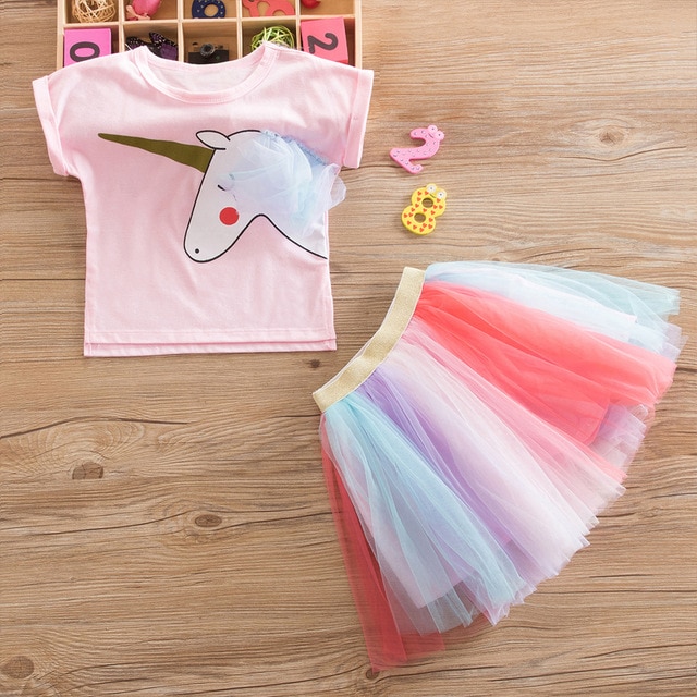 Pink unicorn shirt with rainbow skirt.
