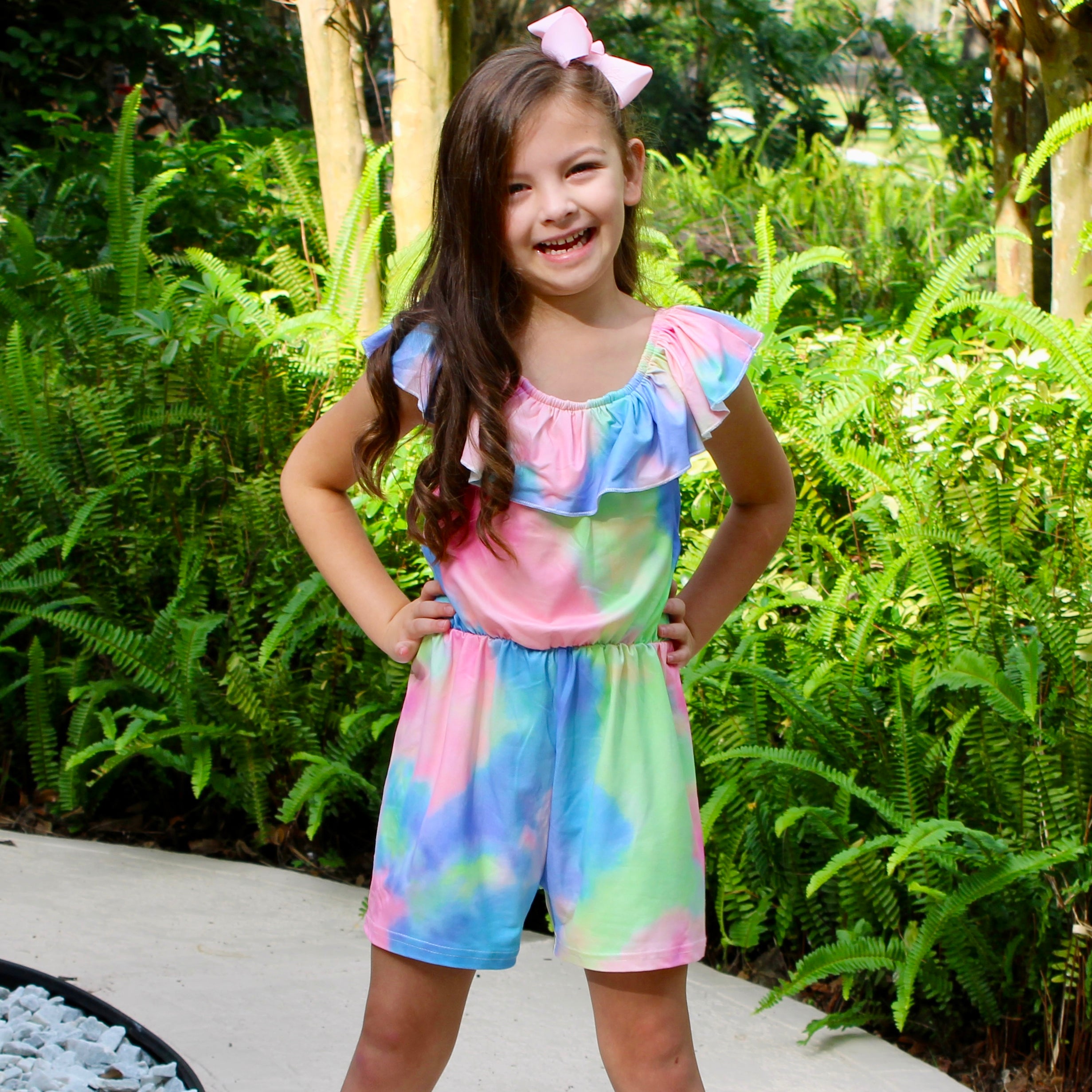 Girls pastel tie dye shorts jumpsuit with ruffle neckline and tie sash, perfect for spring and Easter.
