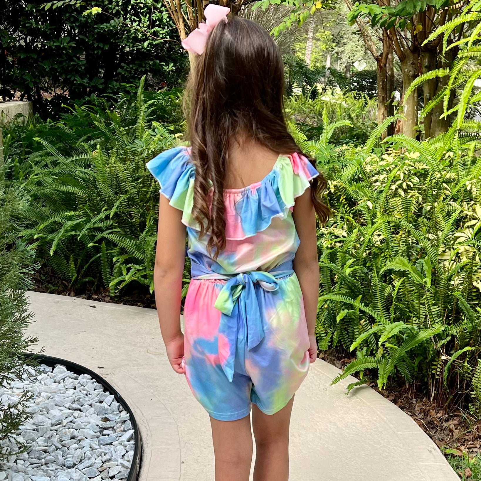 Girls pastel tie dye shorts jumpsuit with ruffle neckline and tie sash, perfect for spring and Easter.