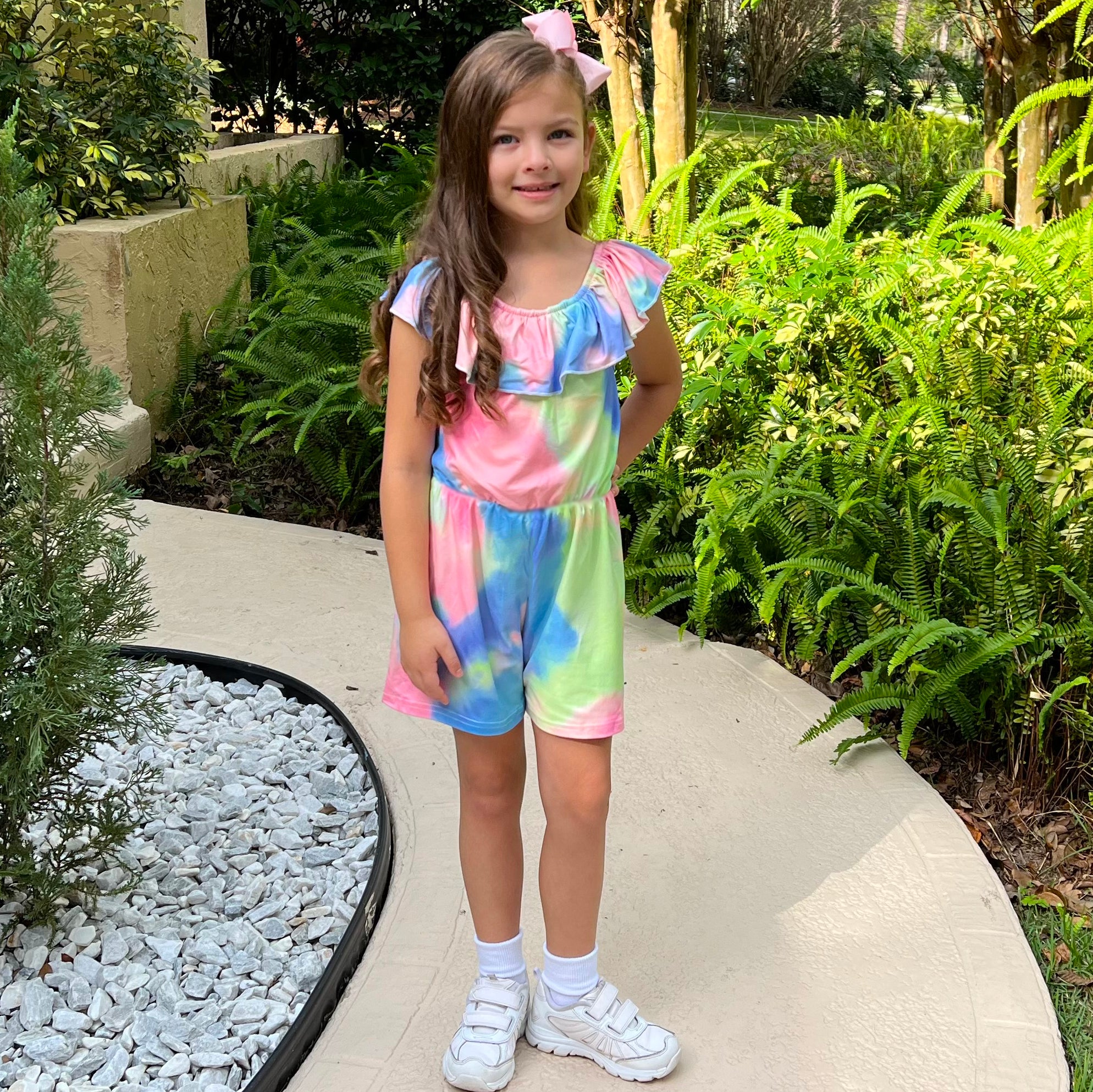 Girls pastel tie dye shorts jumpsuit with ruffle neckline and tie sash, perfect for spring and Easter.