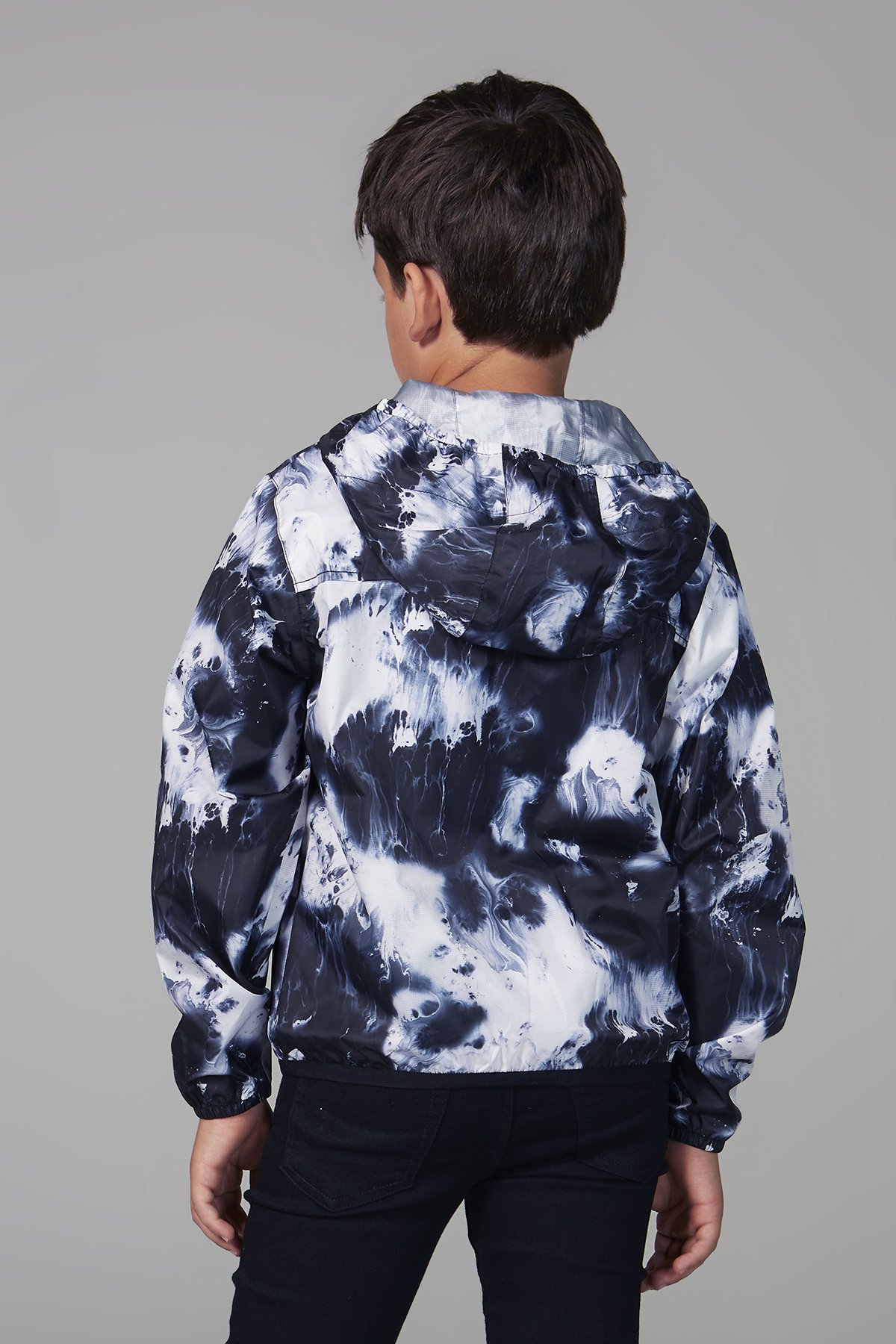 Kids oil print packable rain jacket in vibrant colors, showcasing its waterproof material and packable design.