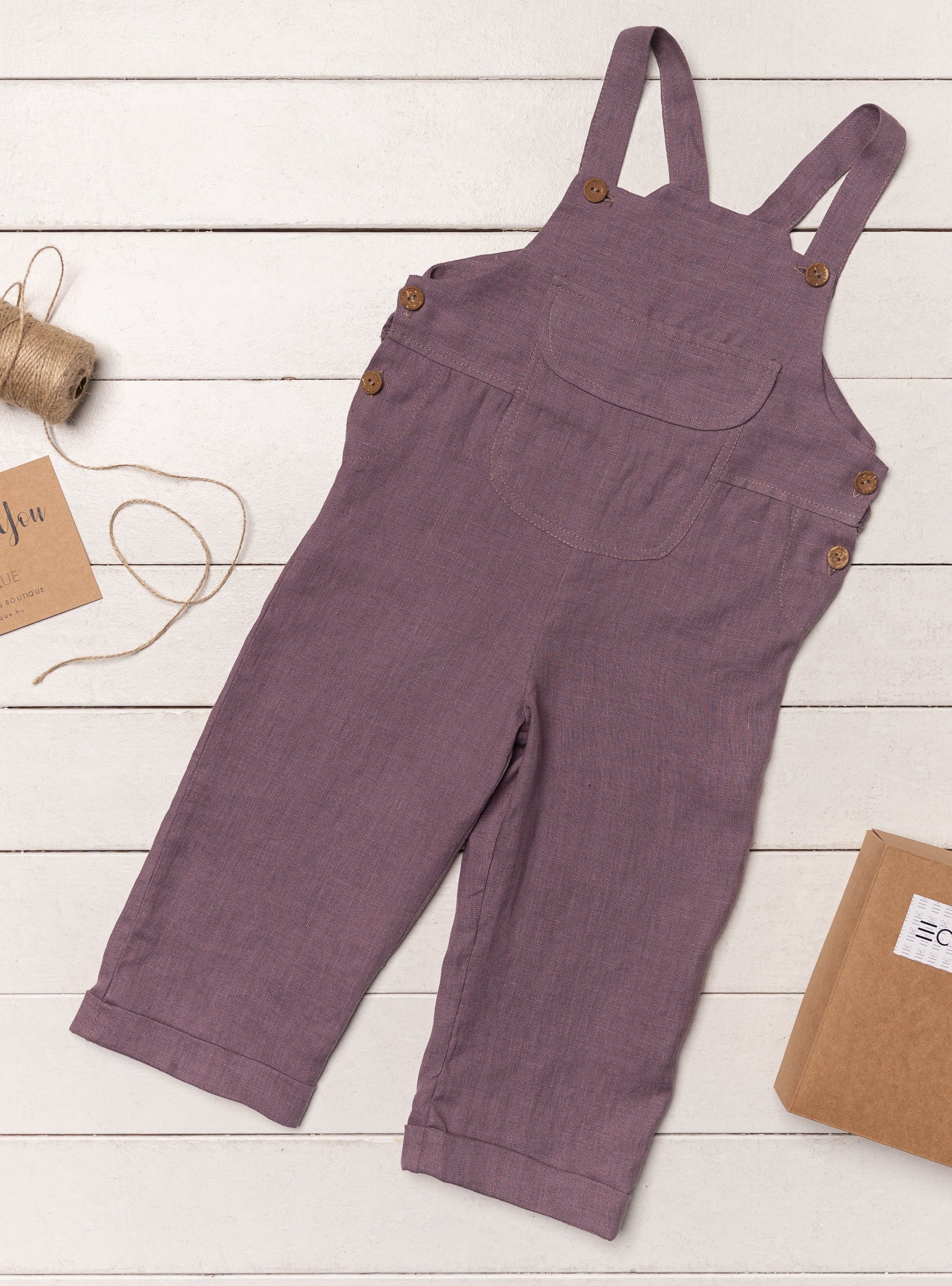 A stylish Linen Jumpsuit for Kids made from 100% European linen, featuring coconut buttons and available in various colors.