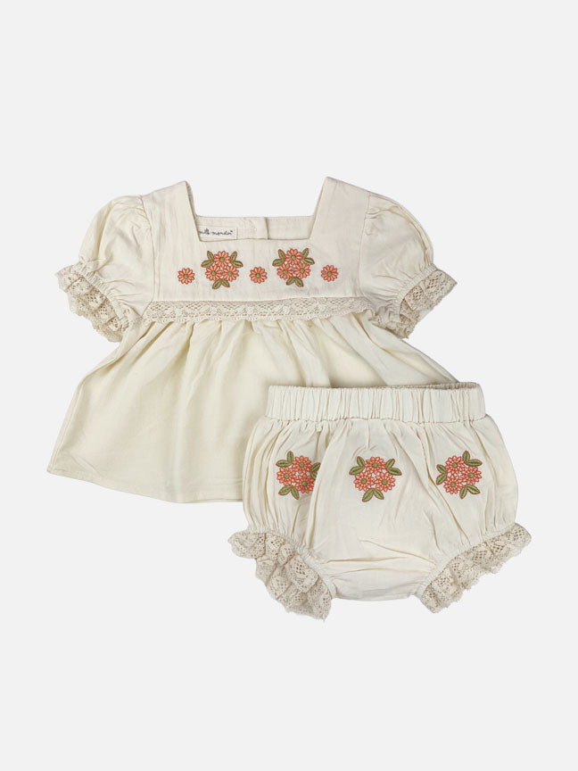 Louisa embroidered set featuring cream floral design, lace trimmed sleeves, and matching bloomer shorts.