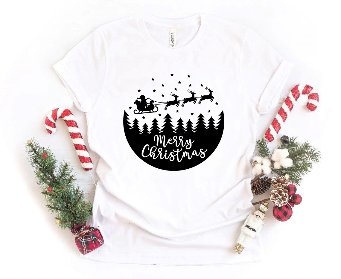 A Merry Christmas Scene With Santa Shirt featuring a festive design, crafted from soft ring spun cotton, available in multiple colors.