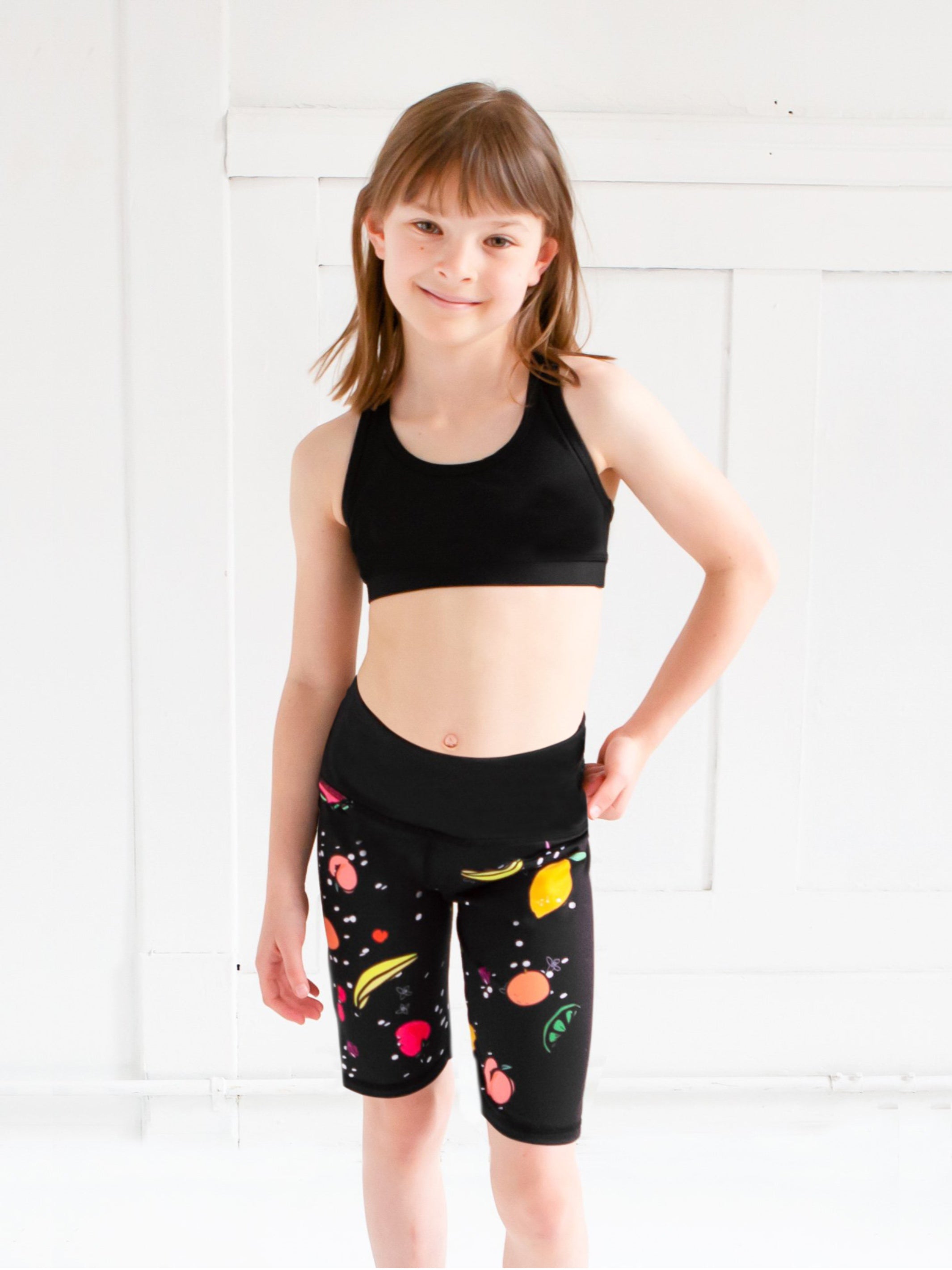 Limeapple Girls Bicycle Shorts in vibrant fruit print, designed for active girls aged 7 to 14, showcasing comfort and style.