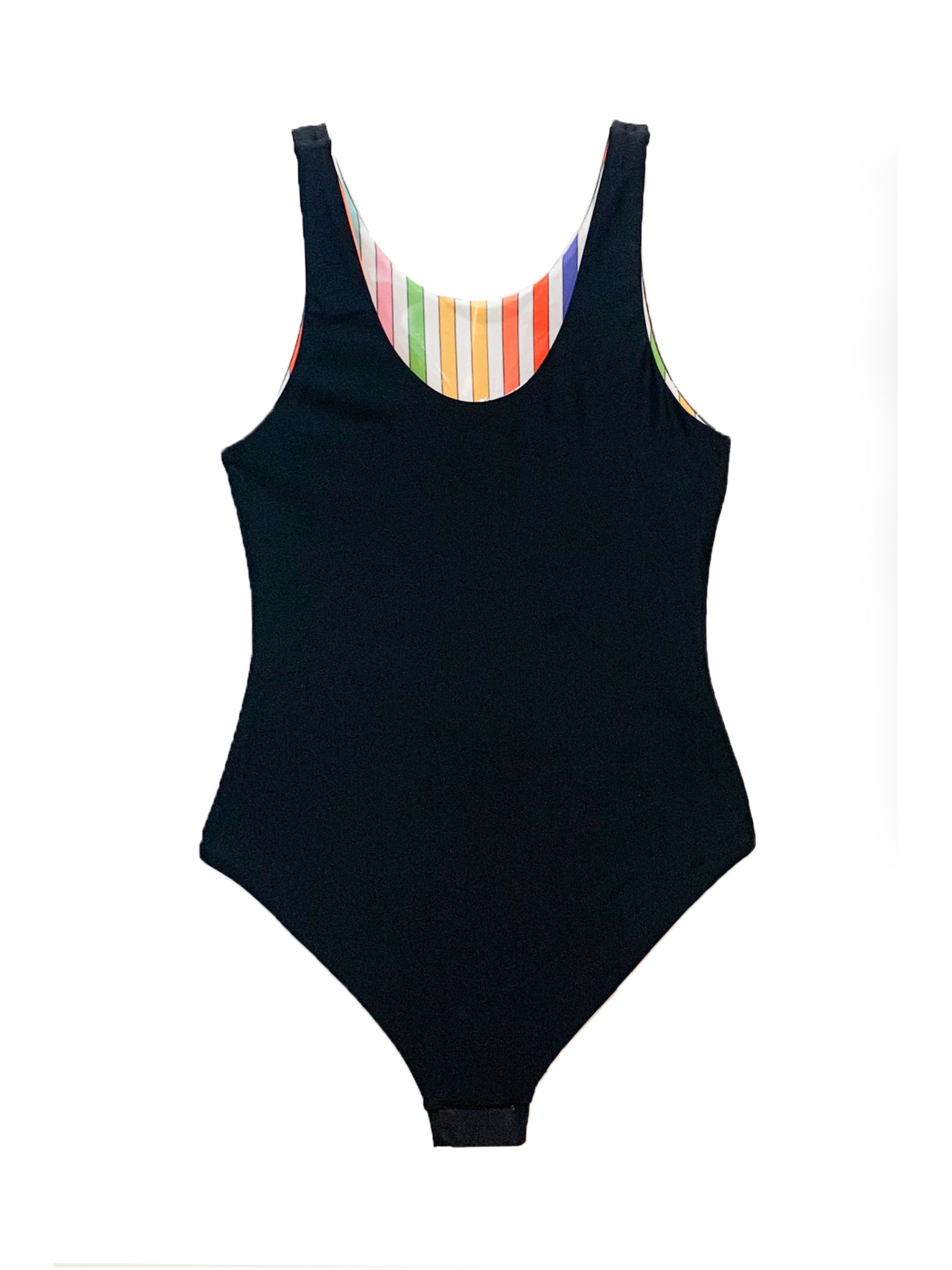 Rebel reversible one-piece swimsuit featuring a black side with sunglasses print and a colorful rainbow stripe side, designed for girls and tweens.