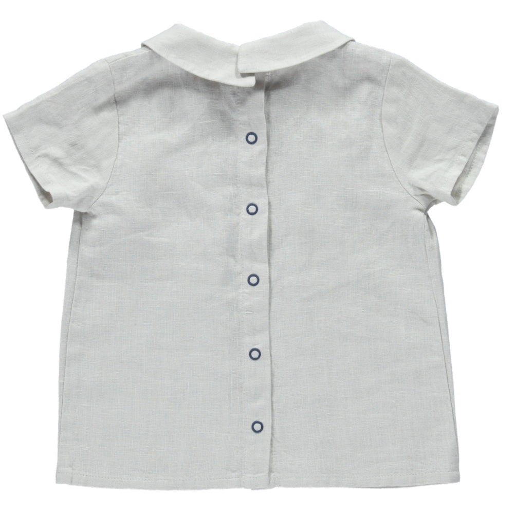 A stylish cream casual shirt made of 100% linen, featuring short sleeves, a round collar, and a snaps closure on the back.