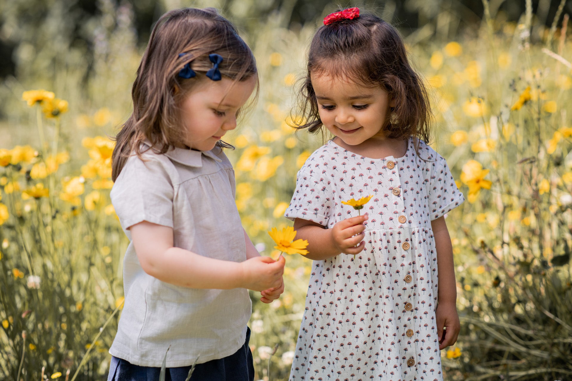 A stylish cream casual shirt made of 100% linen, featuring short sleeves, a round collar, and a snaps closure on the back.