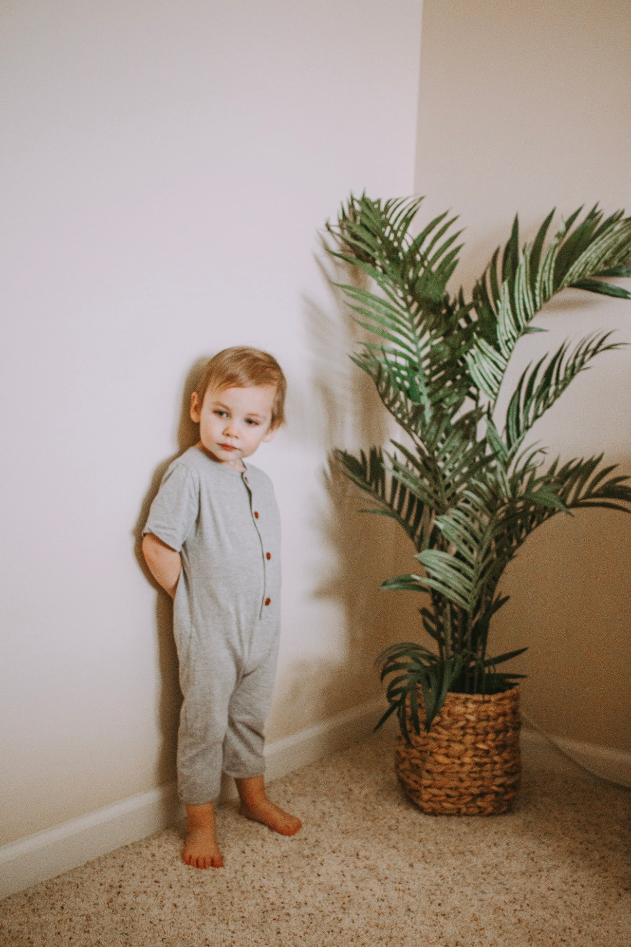 Stylish gray Liam romper made of soft cotton, featuring a comfortable fit and versatile design suitable for various occasions.