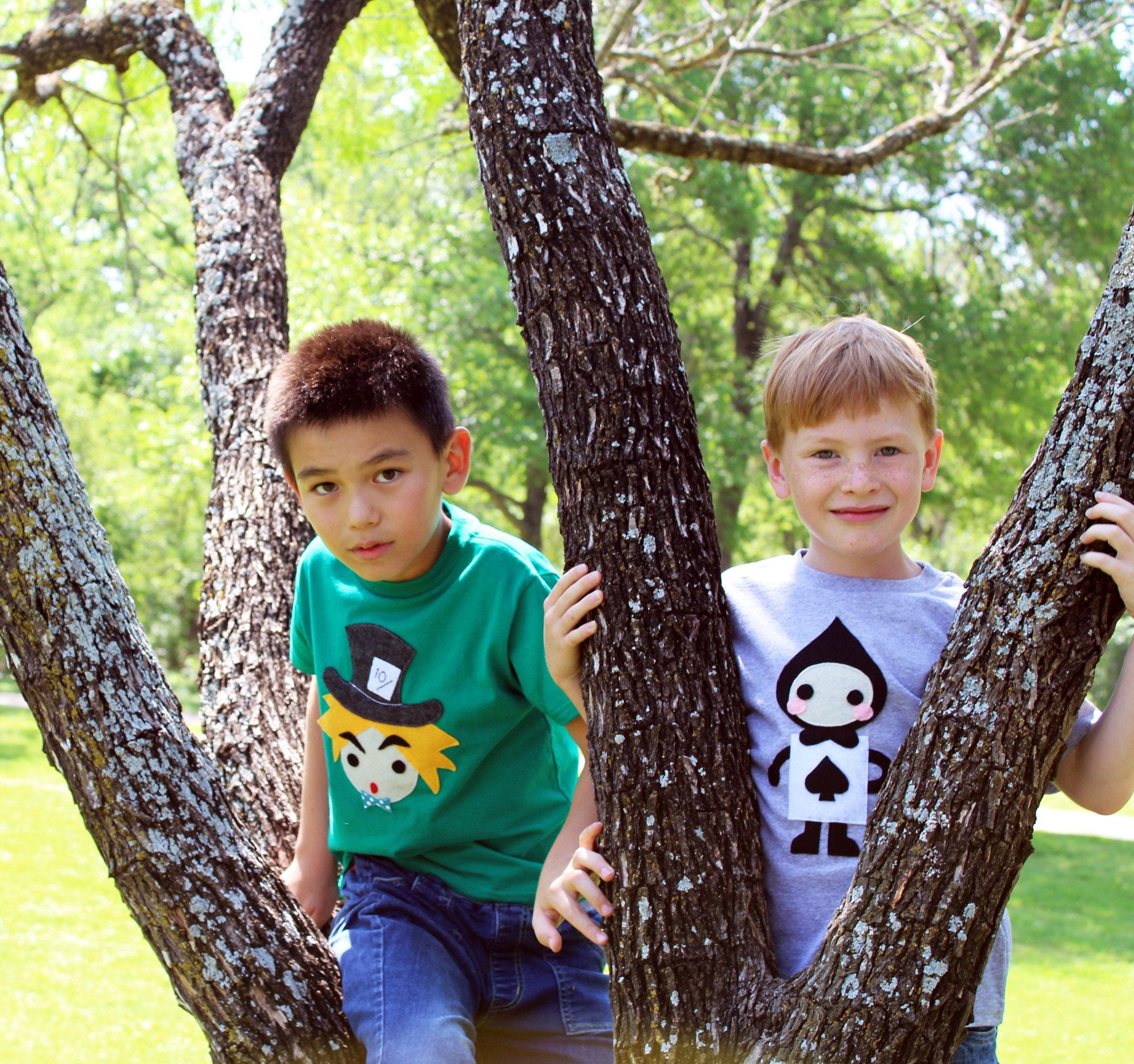 A colorful handmade kids t-shirt featuring The Hatter from Alice's Adventure in Wonderland, with eco felt appliqué design.