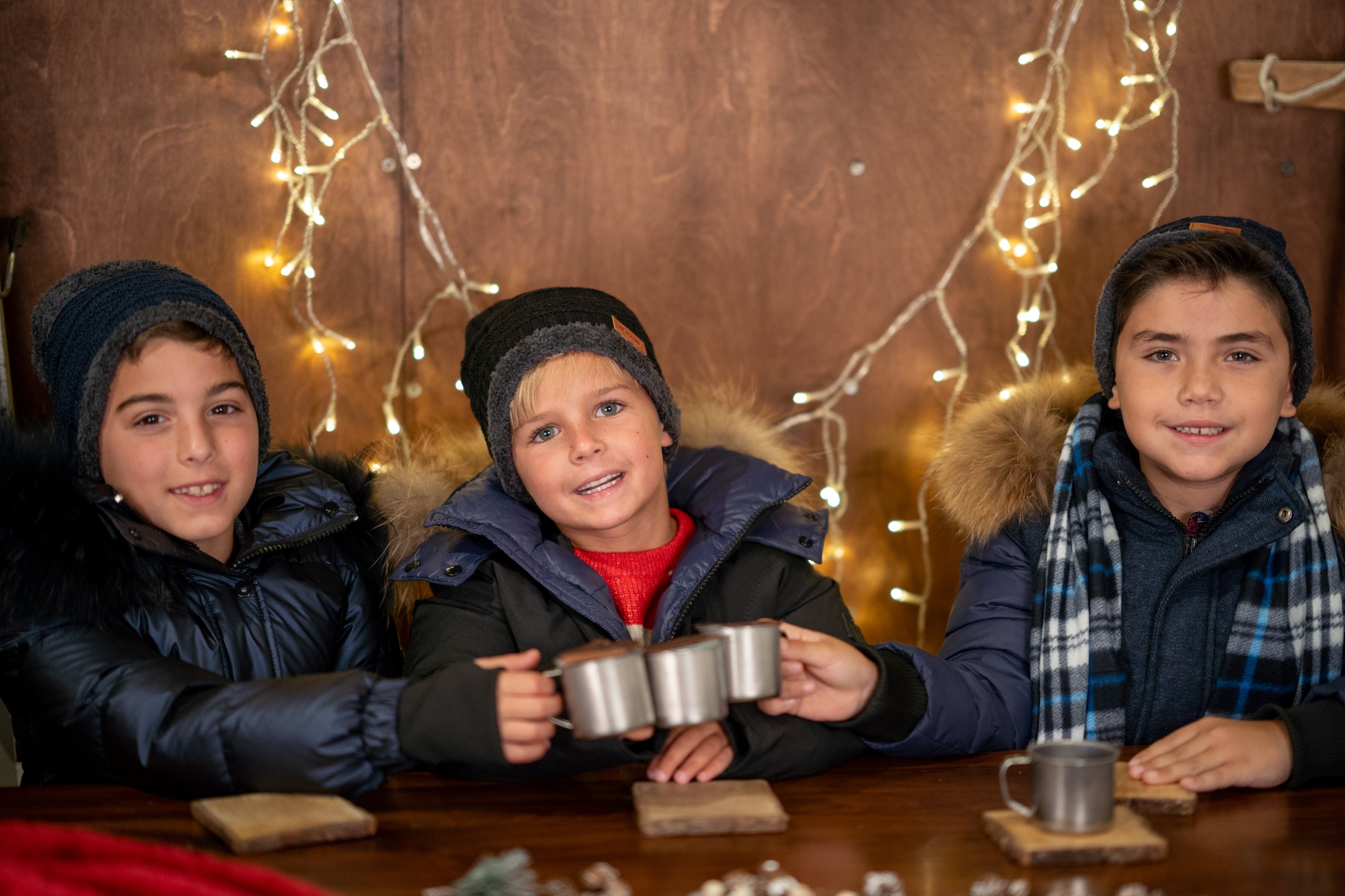 The River Wye unisex coat in navy with fur trim, showcasing a stylish design with black speckles.