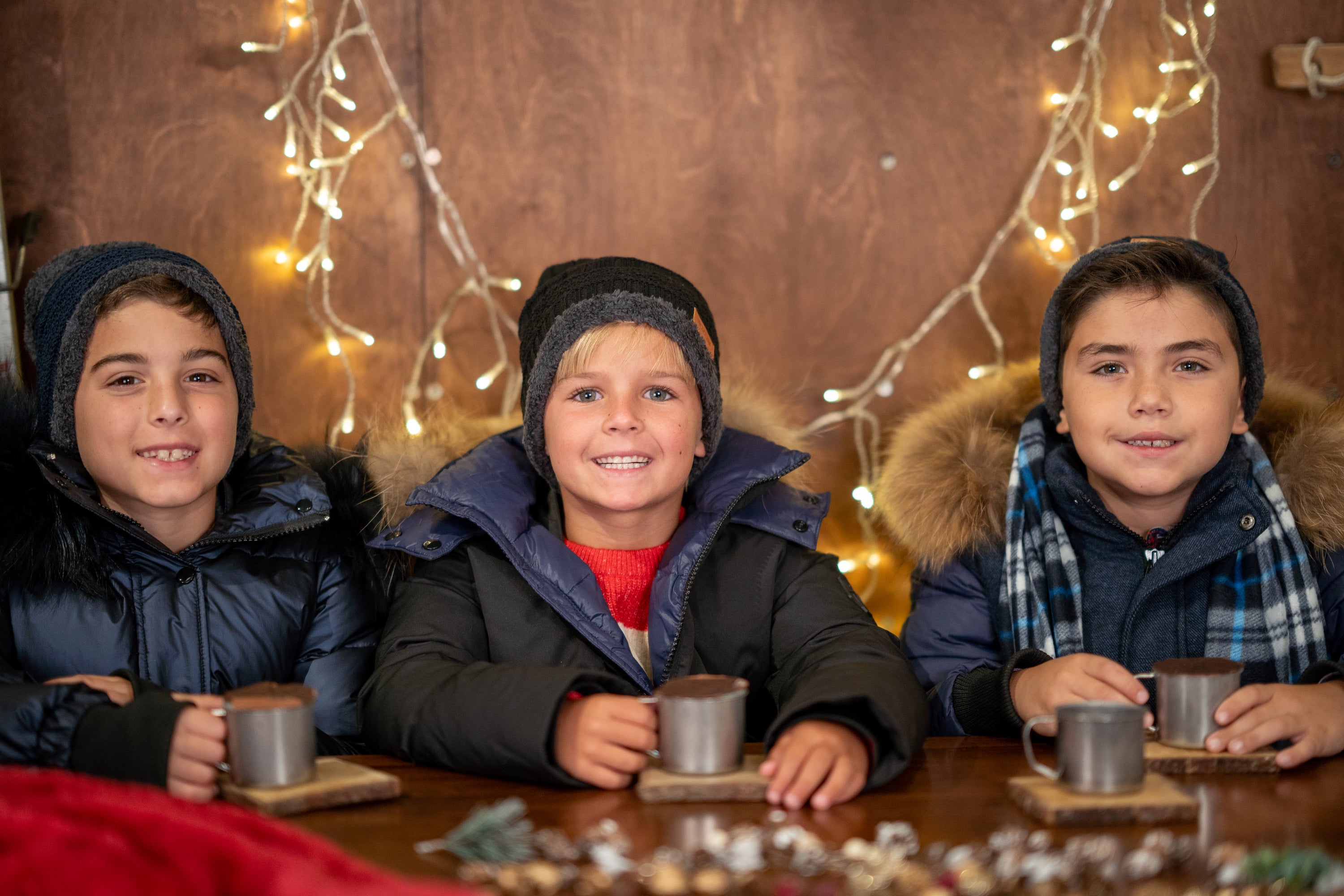 The River Wye unisex coat in navy with fur trim, showcasing a stylish design with black speckles.