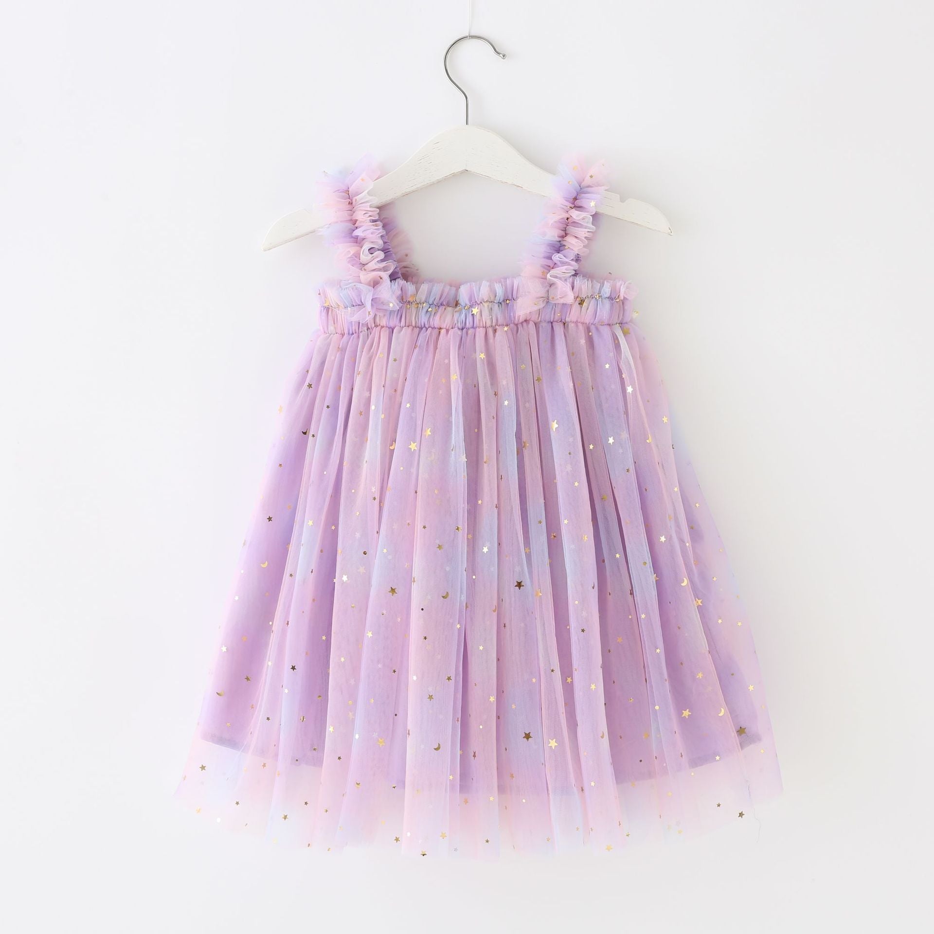 A beautiful tulle dress featuring a moon and stars print with a gradient of pastel colors including pink, purple, teal, and yellow.