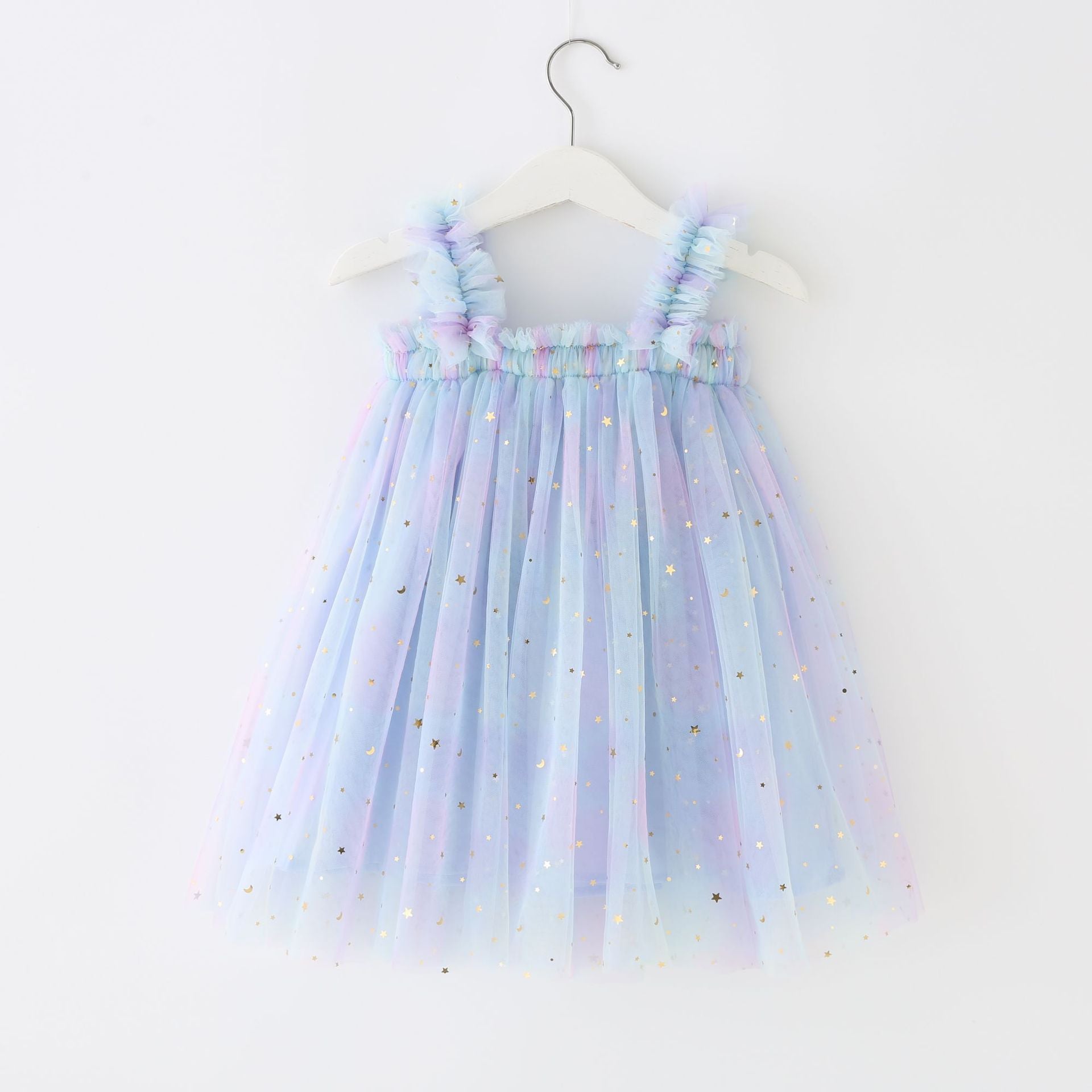 A beautiful tulle dress featuring a moon and stars print with a gradient of pastel colors including pink, purple, teal, and yellow.