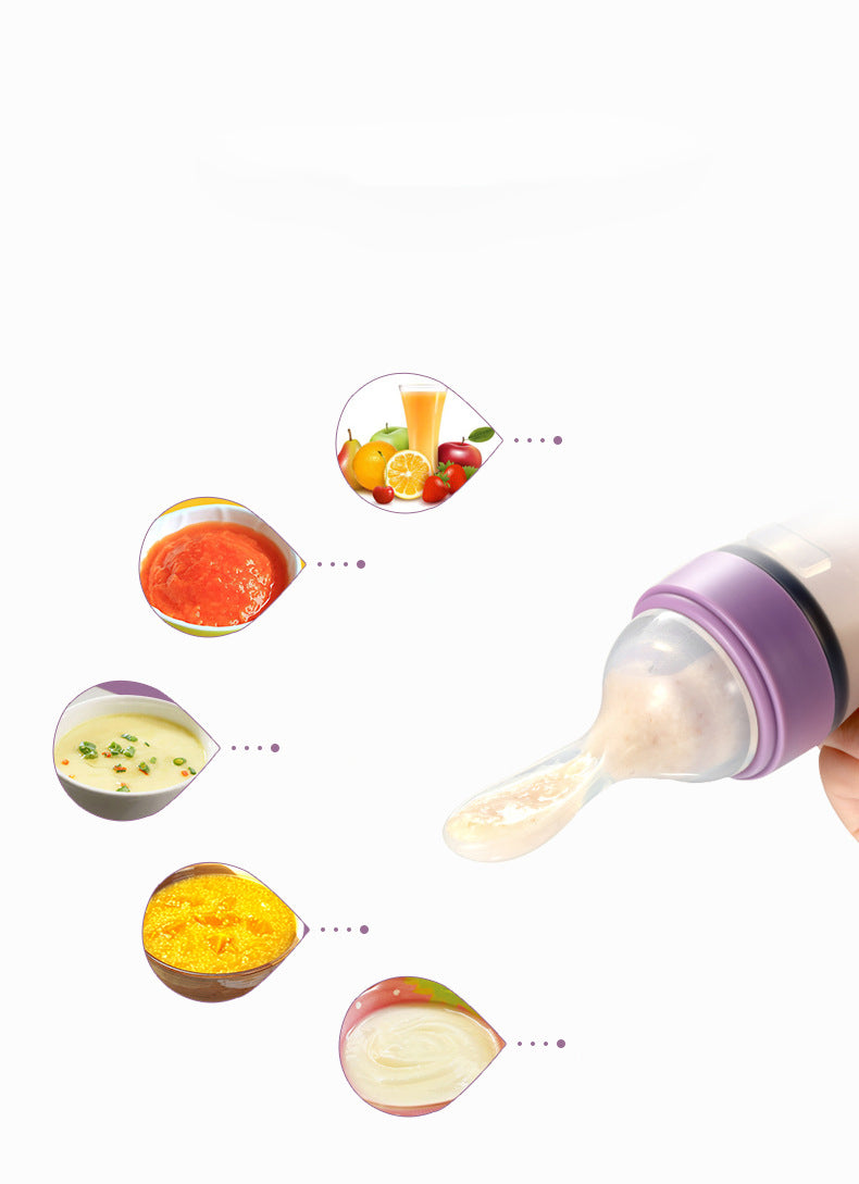 A purple silicone baby feeding bottle with a squeeze spoon, designed for easy feeding of cereals and semi-liquid foods.