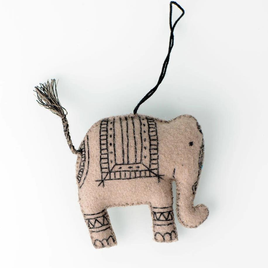 Handcrafted felt ornaments featuring a cow and elephant design, beautifully stitched and embroidered.