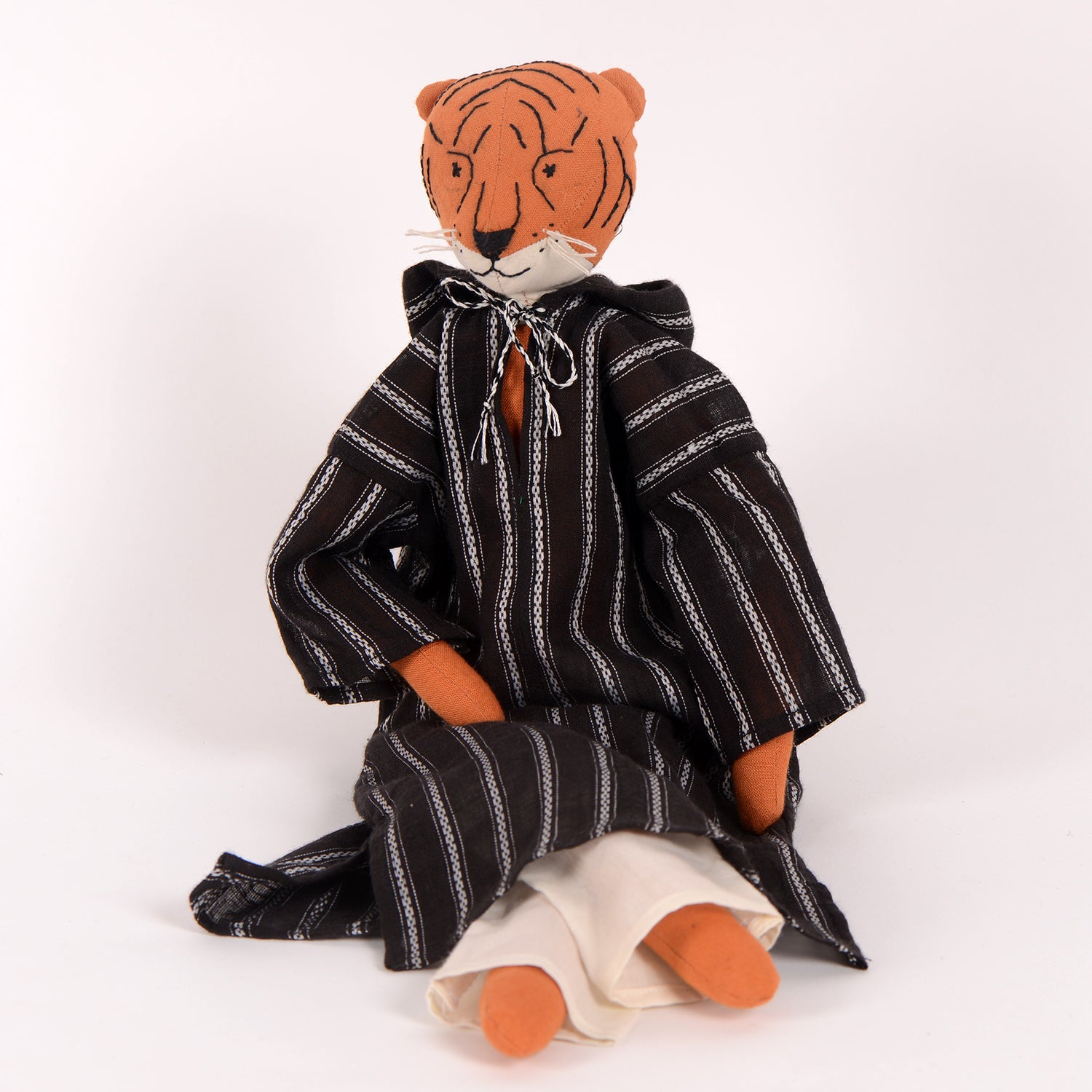 Djour the Tiger handcrafted cotton doll with woollen hair, featuring vibrant colors and a foldable box for bedding.
