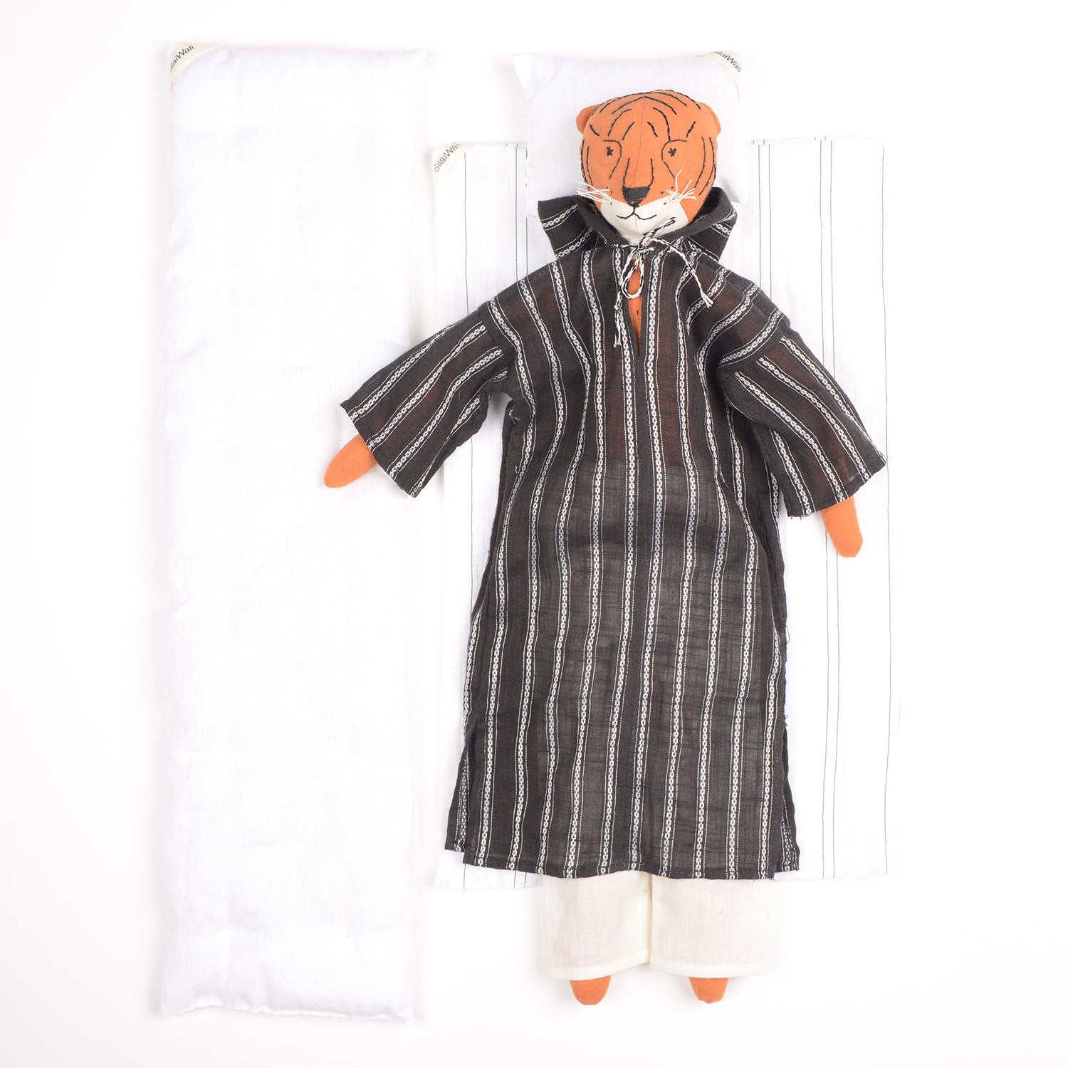 Djour the Tiger handcrafted cotton doll with woollen hair, featuring vibrant colors and a foldable box for bedding.