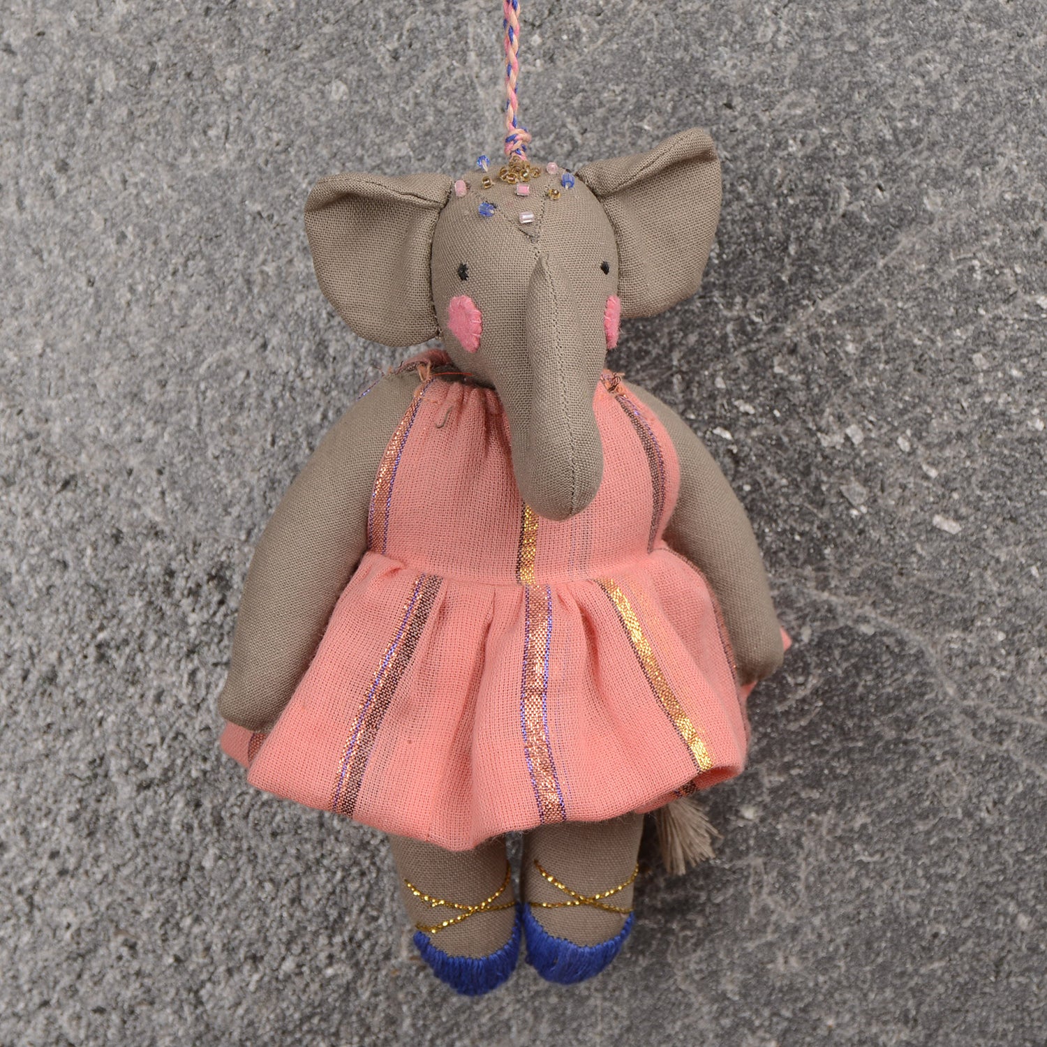 Kamal_01 handcrafted festival ornament made from upcycled waste fabric, featuring vibrant colors and intricate designs.