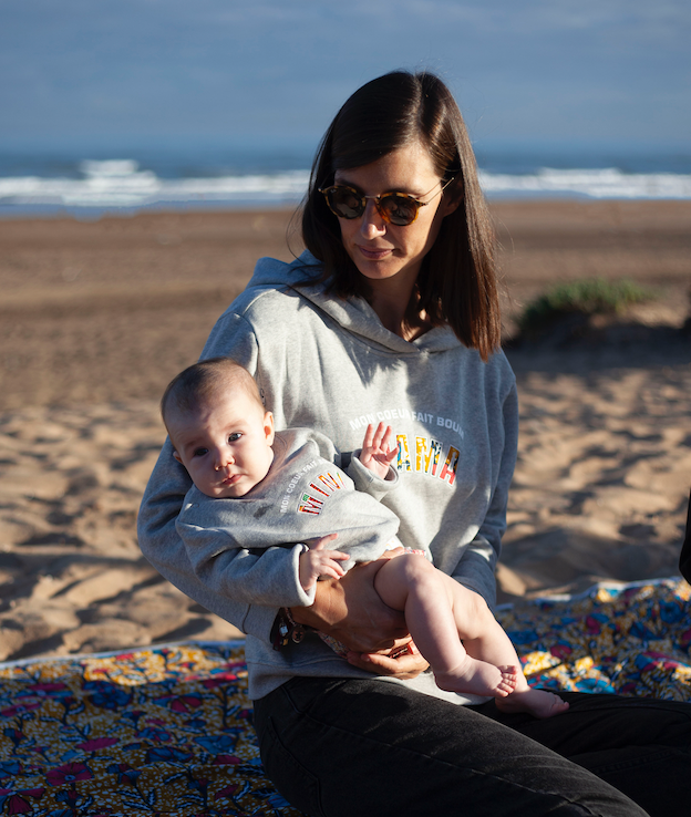 Limited Edition Mon Coeur Fait Boum Mini sweatshirt in heather grey with vibrant African Wax Fabric letters.