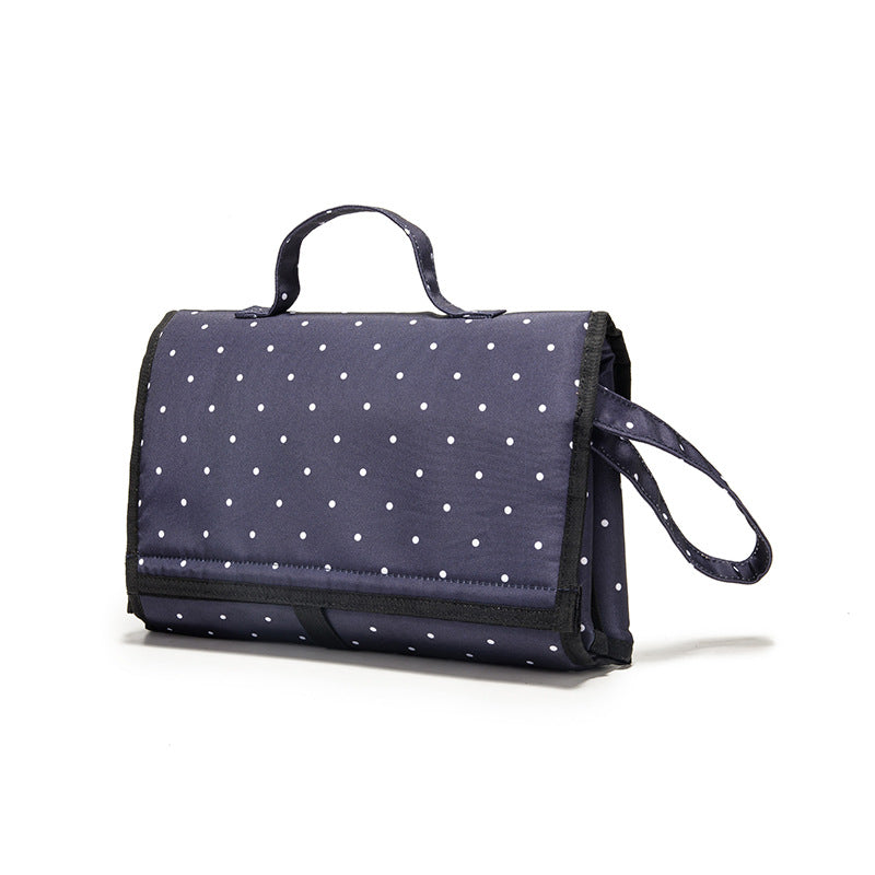 Multifunction Travel Waterproof Portable Diaper Change Pad in stylish design, featuring multiple pockets for organization and a waterproof surface.