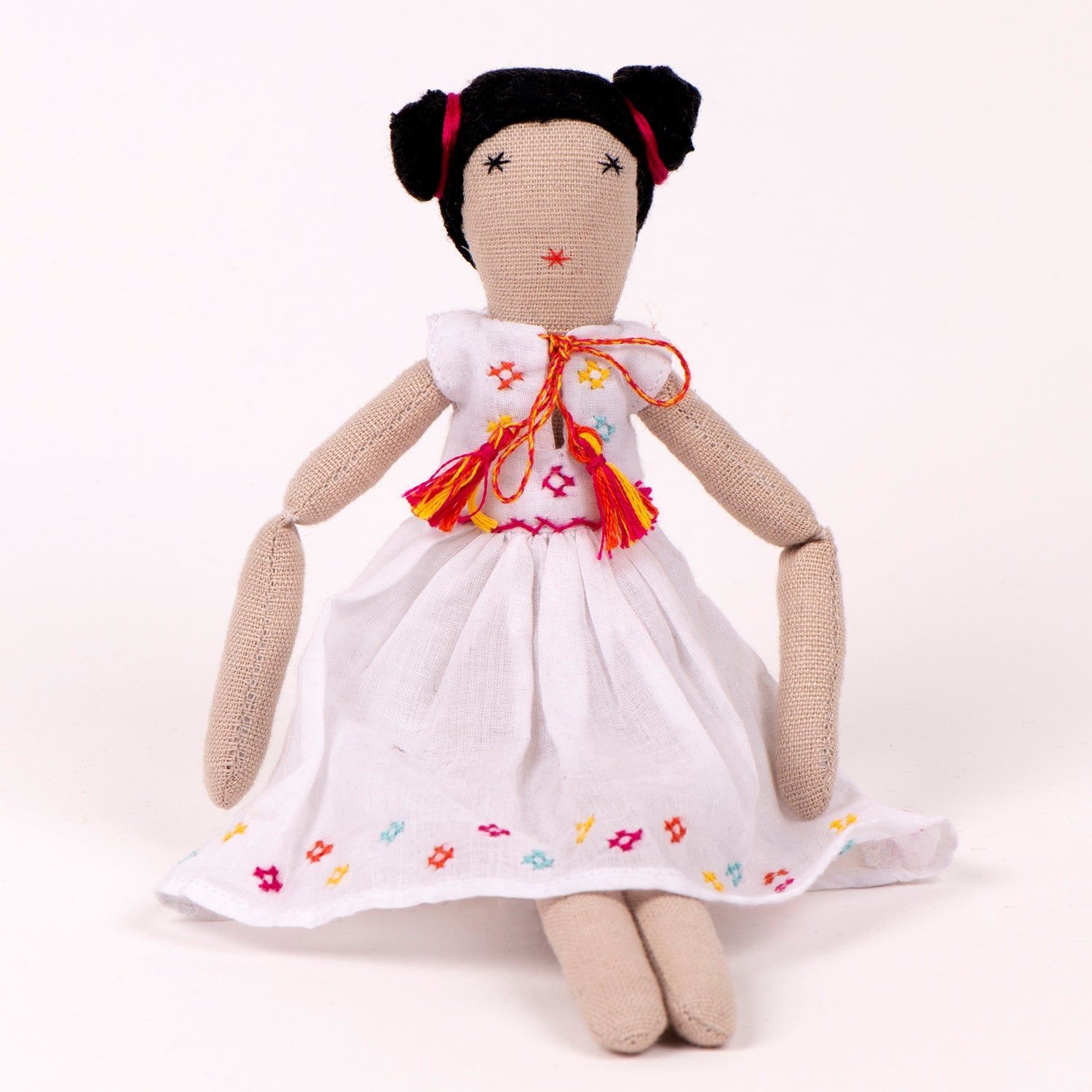 Nargis Mini doll with light muslin frock and colorful ribboned hair, showcasing intricate embroidery and charming design.