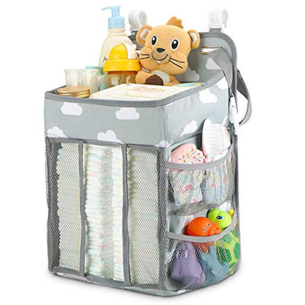 Portable Baby Crib Organizer Bed Hanging Bag in a nursery setting, showcasing its compartments for baby items.