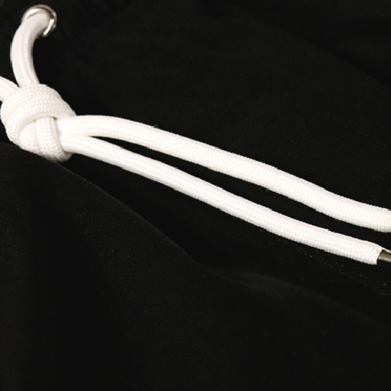 Stylish Black swimwear made from recycled materials, featuring a comfortable mesh liner and advanced water-repellent technology.