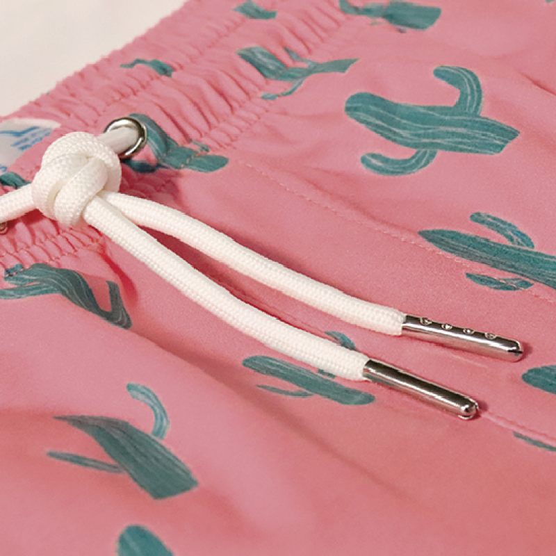 Cactus 2.0 swim trunks featuring a vibrant design, made from recycled materials, showcasing pockets and a comfortable mesh liner.