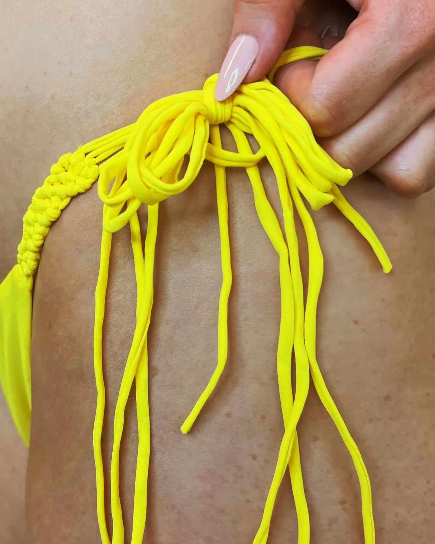 Cove two piece swimsuit featuring a stylish solid design, perfect for beach and pool activities, made from durable polyester material.