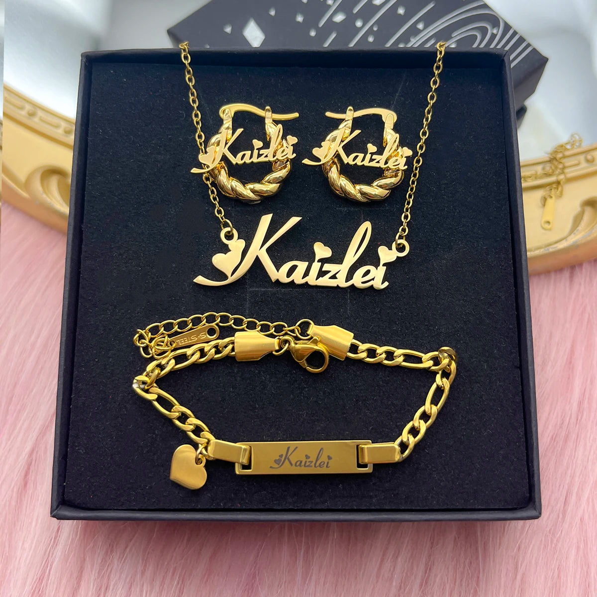 Cute mini personalized jewelry set featuring a heart design, made of stainless steel, includes necklace, earrings, and bracelet in gold, silver, and rose gold.
