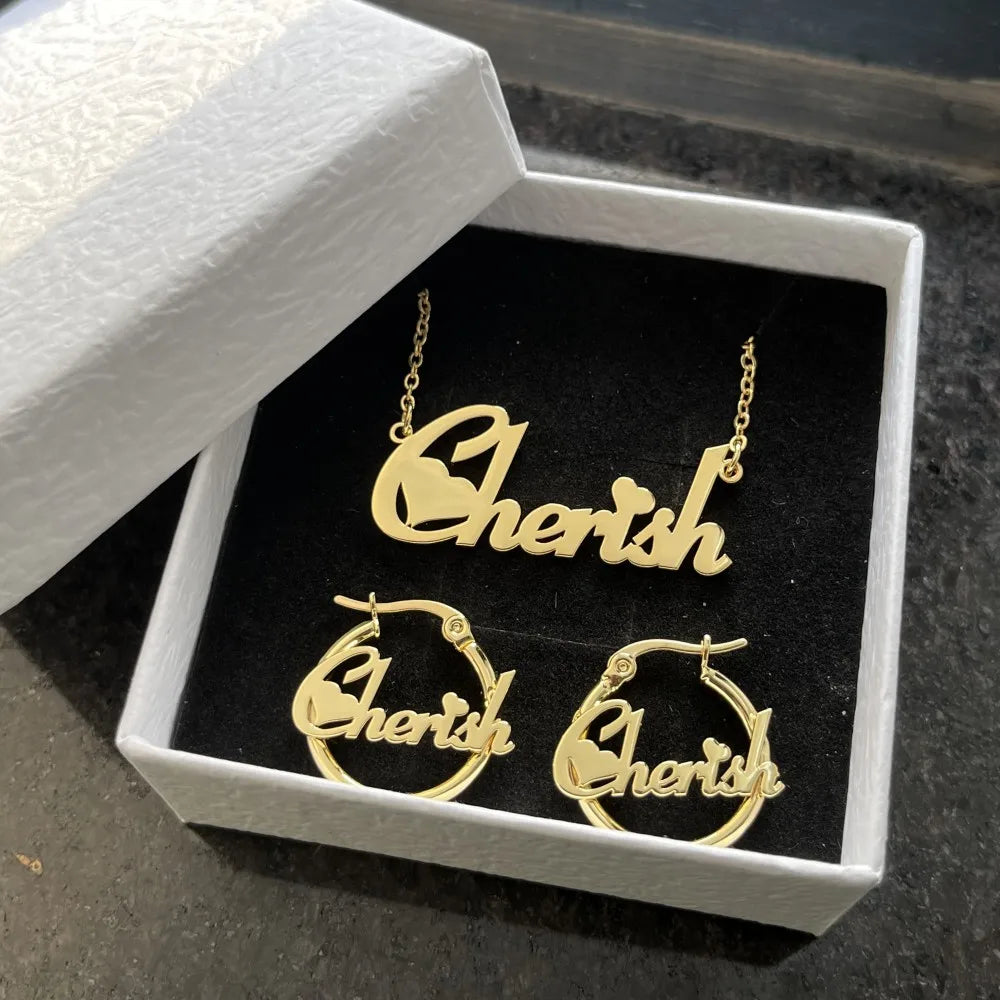 Cute mini personalized jewelry set featuring a heart design, made of stainless steel, includes necklace, earrings, and bracelet in gold, silver, and rose gold.