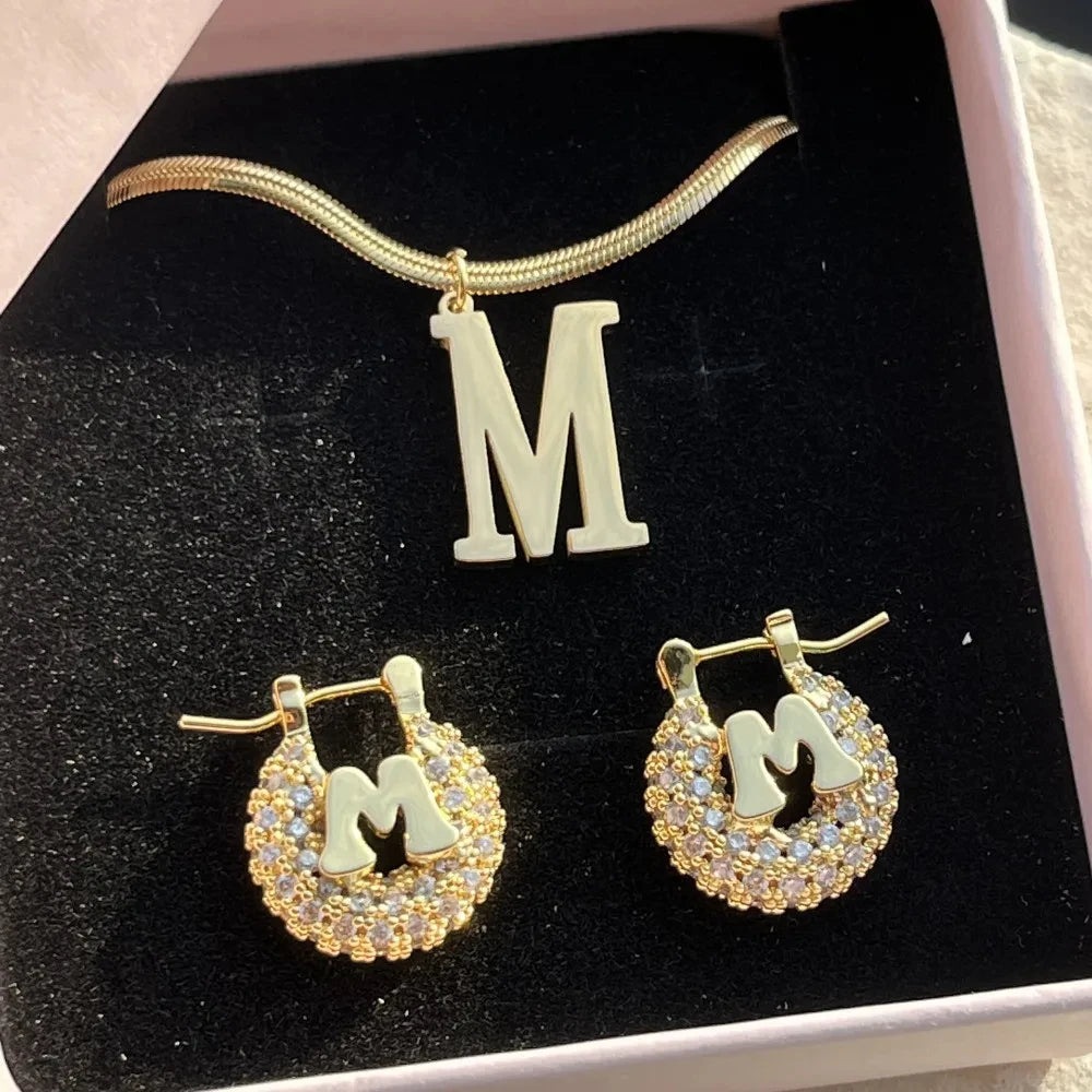 Cute mini personalized jewelry set featuring a heart design, made of stainless steel, includes necklace, earrings, and bracelet in gold, silver, and rose gold.