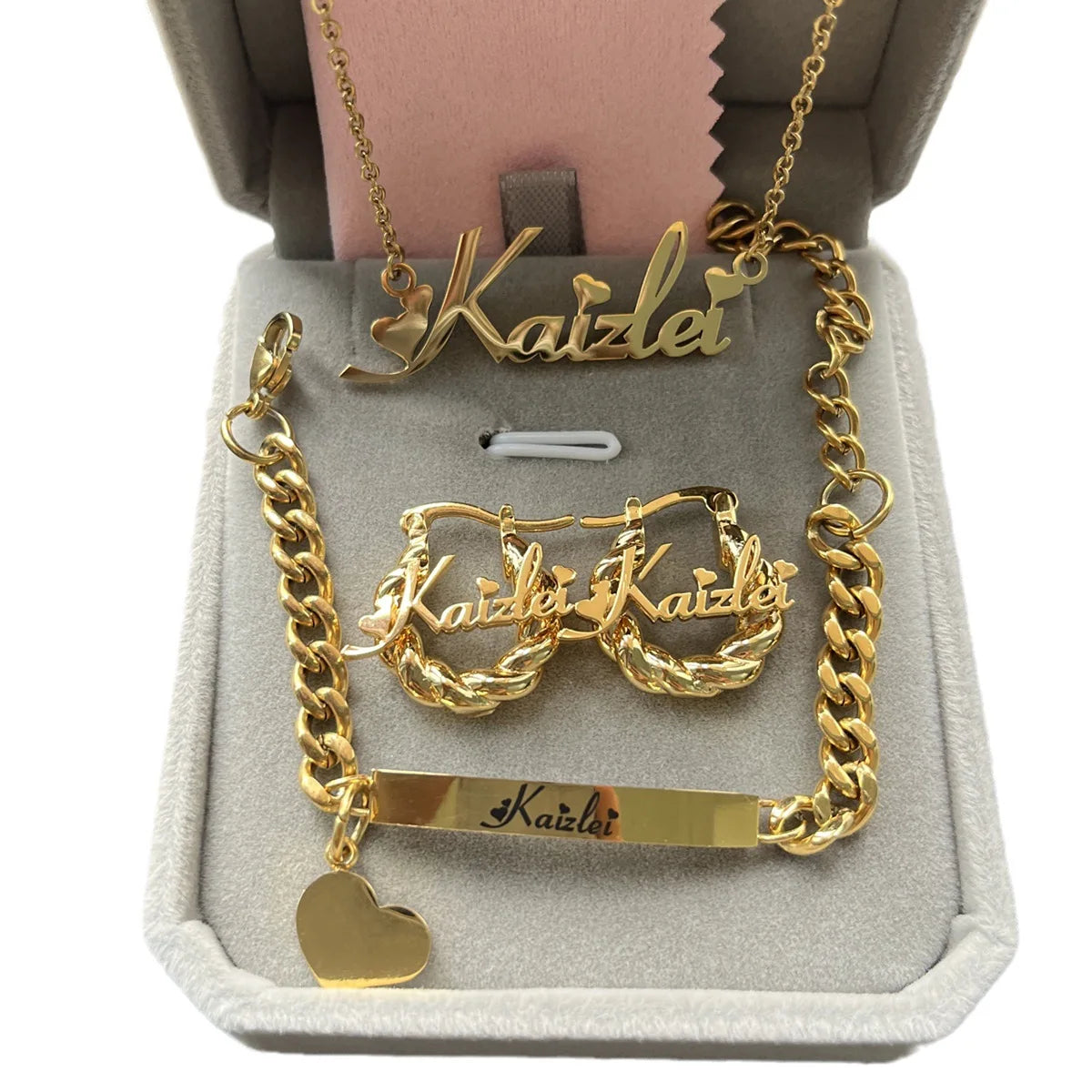 Cute mini personalized jewelry set featuring a heart design, made of stainless steel, includes necklace, earrings, and bracelet in gold, silver, and rose gold.