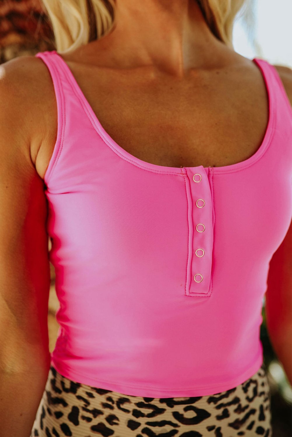 Cute pink tankini set featuring a square neck and leopard print design, perfect for summer beach outings.