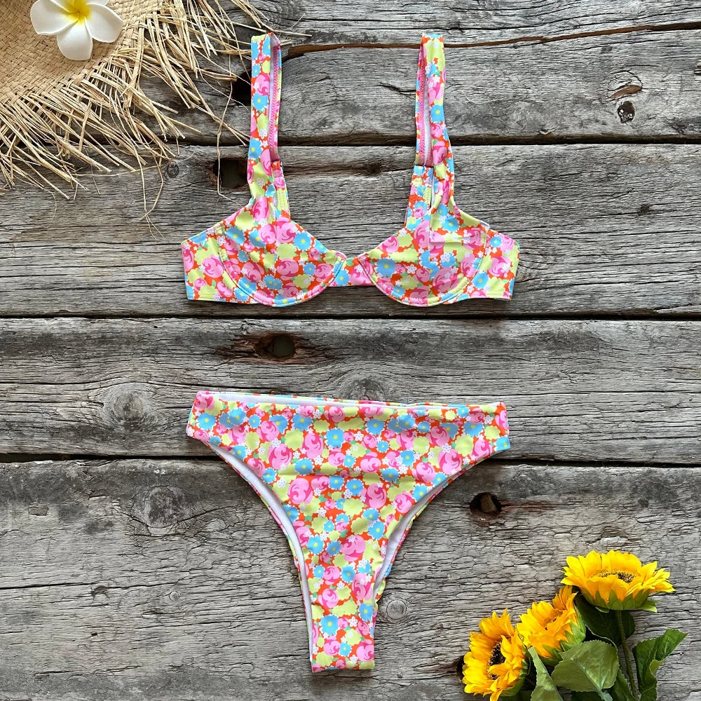 Floral Funky two piece swimsuit by Sexikinis Swim featuring vibrant floral patterns and a trendy low waist cut.