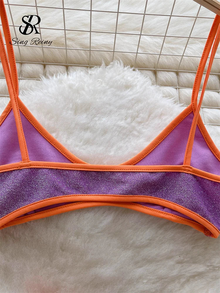 Hennie High Waist Two Piece Swimsuit featuring stylish buttons, pockets, and a modern V-neck collar, perfect for summer outings.