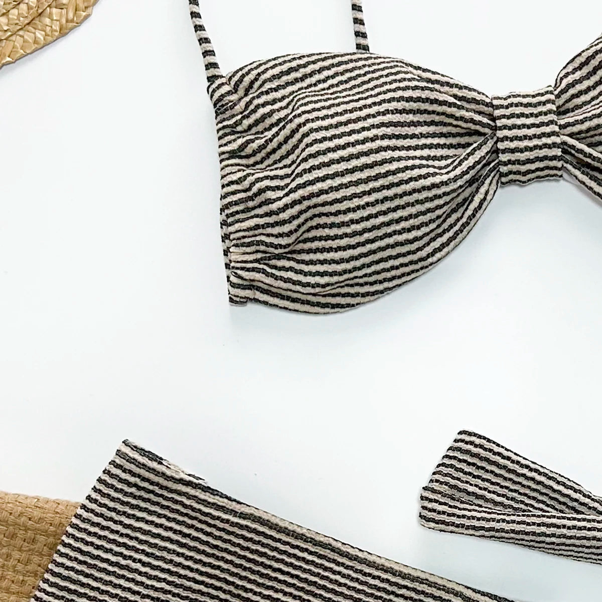 Melia three piece vacation swimsuit with cover up featuring high waist design and striped pattern in brown color.