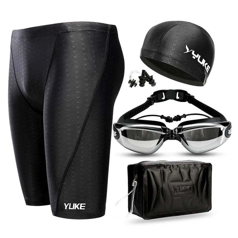 Men's swimming shorts set featuring shark skin design, swim goggles, and ear plugs for aquatic adventures.