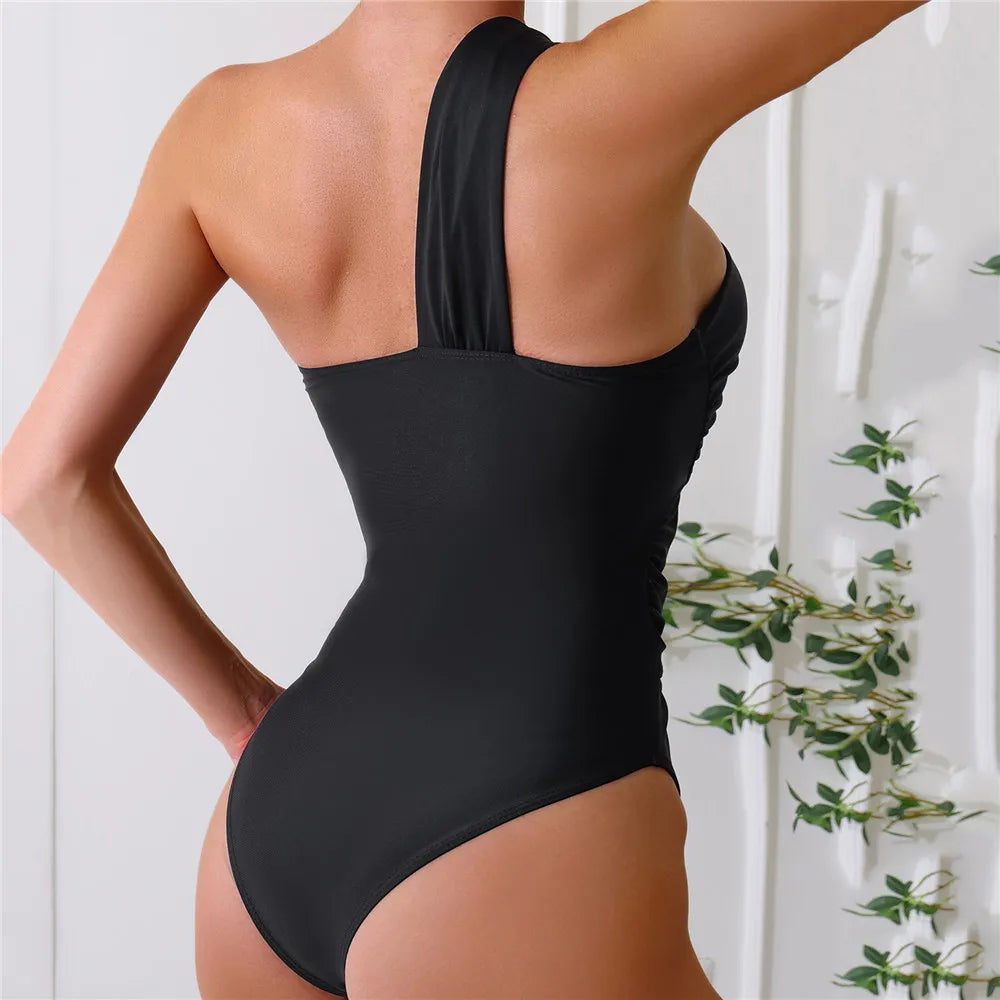 One Shoulder Sexy Black One Piece Swimsuit displayed on a mannequin, showcasing its elegant design and premium SPANDEX material.