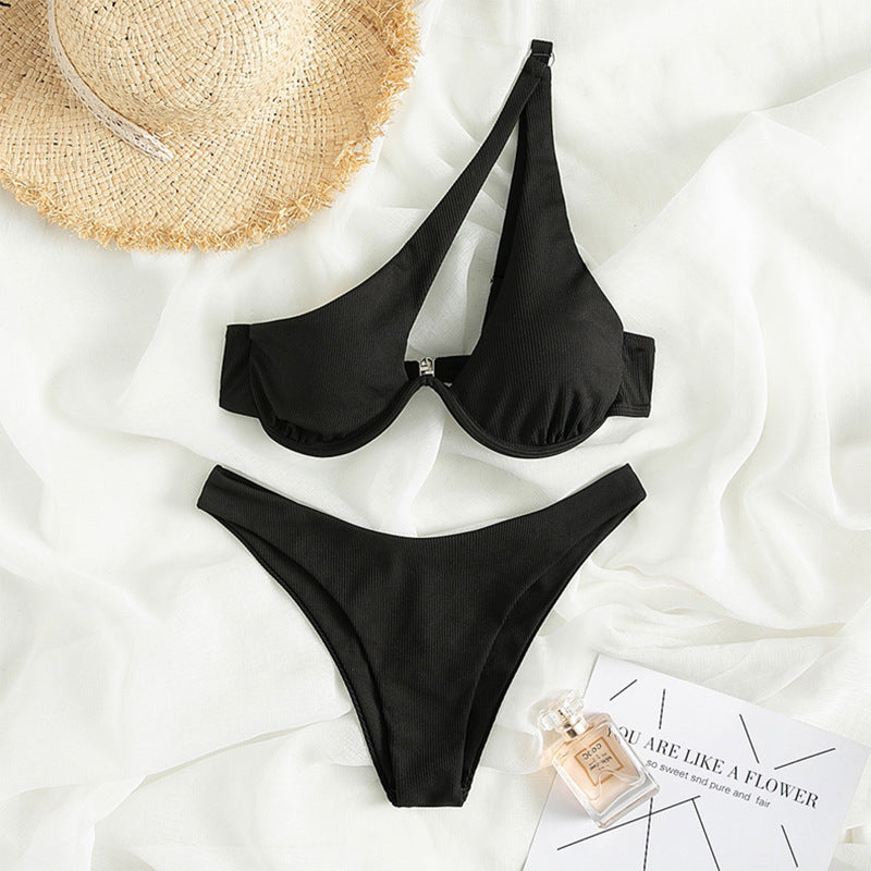A stylish one shoulder black swimsuit featuring a sexy triangle cut and underwire support, perfect for beach or pool wear.